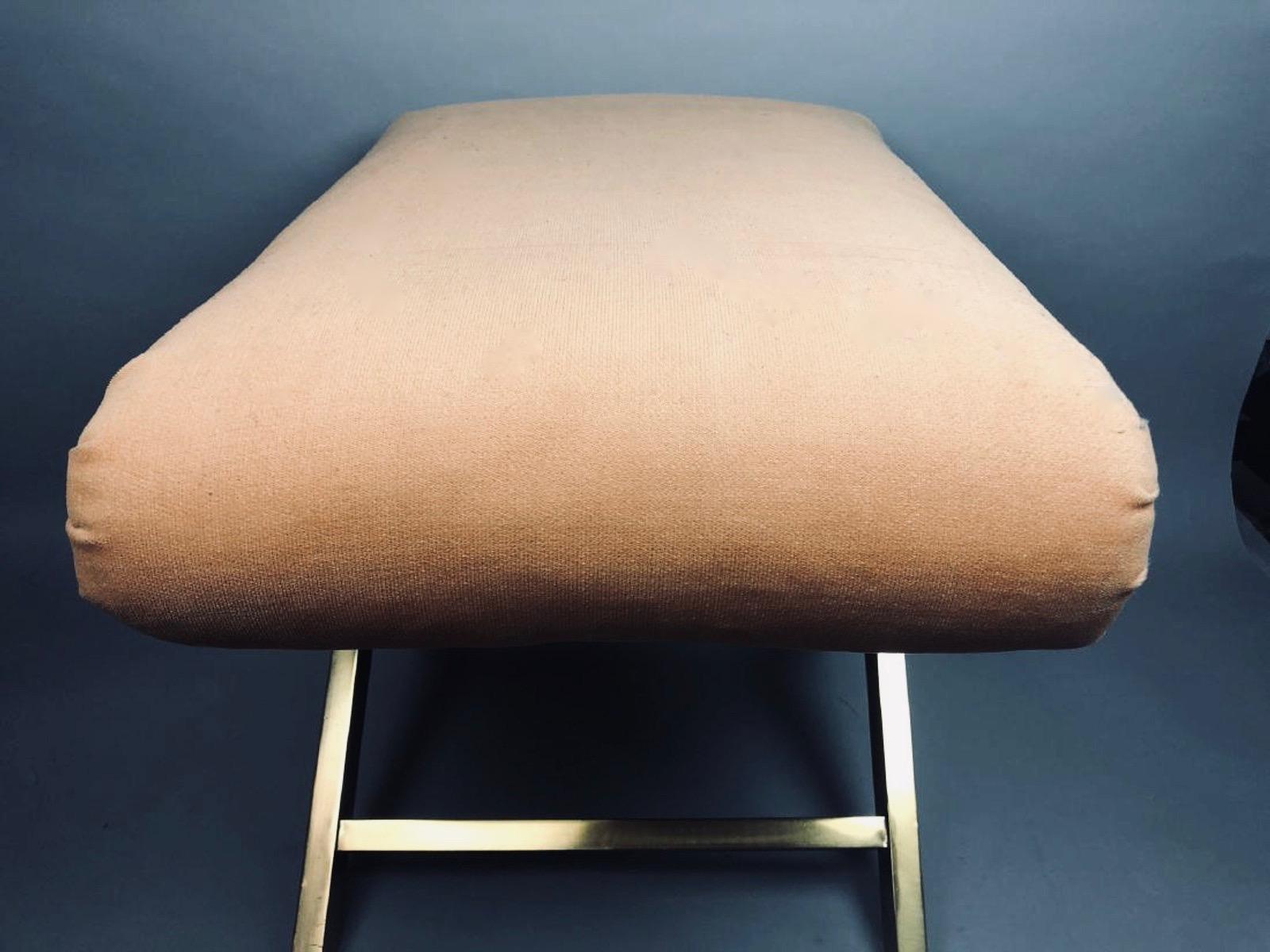 Weiman-Warren blush velvet & brass crossed-base ottoman, glamour stool, bench with Weiman label underneath. Original peachy blush velvet upholstered to perfection. Love the Neoclassical volute-like folds at each corner and the light absorbing, matte