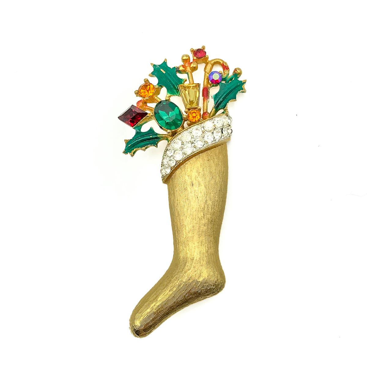 A fab Vintage Christmas Weiss Stocking Brooch. Crafted in gold plated metal and adorned with fancy cut crystals and enamel. Signed. In very good vintage condition. Approx. 6.5cms. A wonderful pop of vintage Christmas glamour that will also prove the