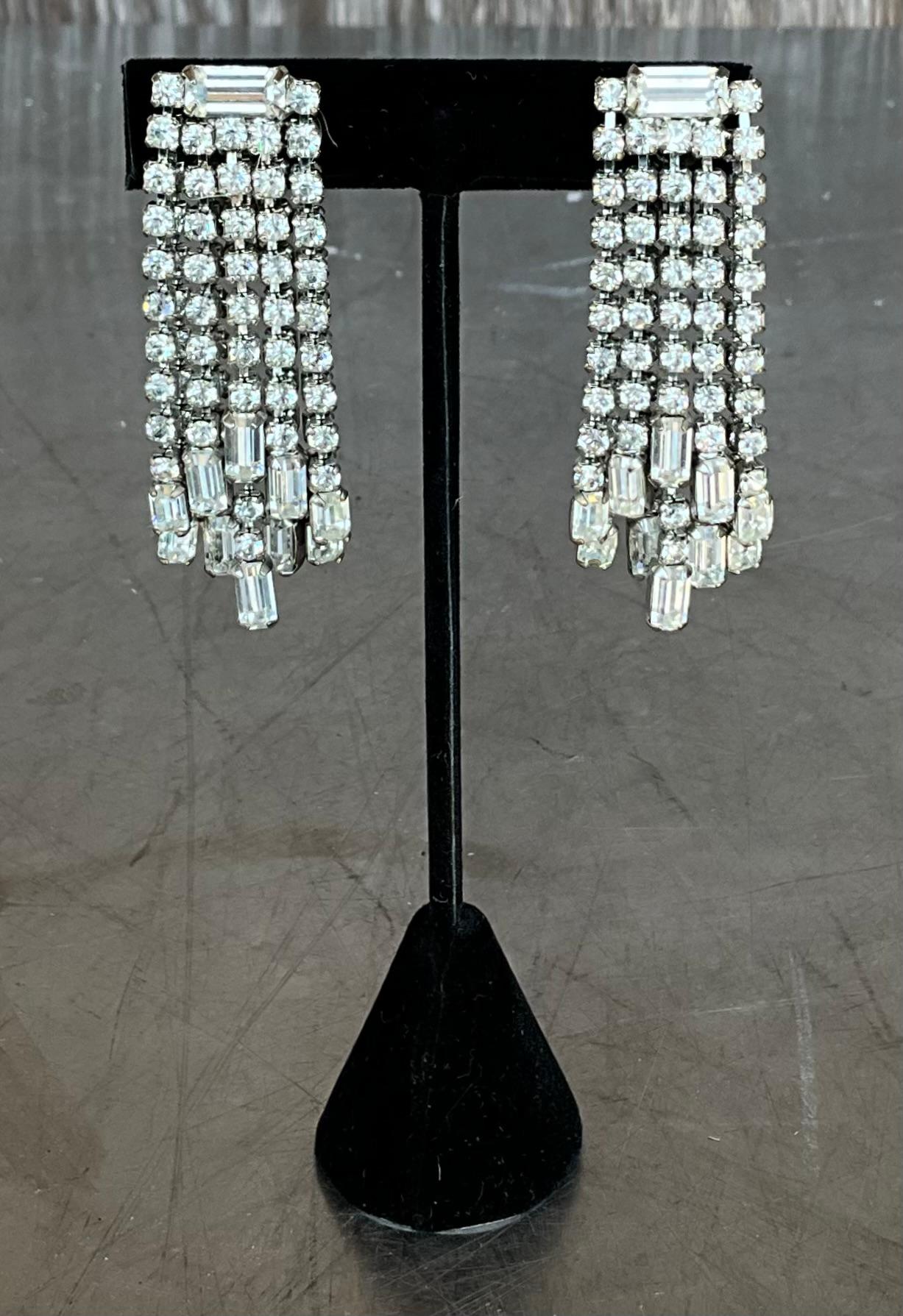 Vintage Weiss rhinestone clip-on earrings are highly sought after by collectors due to their stunning craftsmanship and distinctive designs. Weiss, founded by Albert Weiss in 1942, became known for its high-quality costume jewelry, particularly its