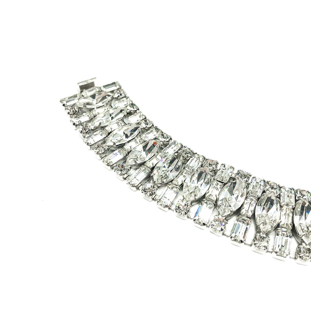 A divine Vintage Weiss Cocktail Bracelet. Featuring fancy cut crystals in baguette, marquise and chaton shapes. Claw set in rhodium plated metal. Weiss produced some of the highest quality mid century American costume jewellery and their pieces are