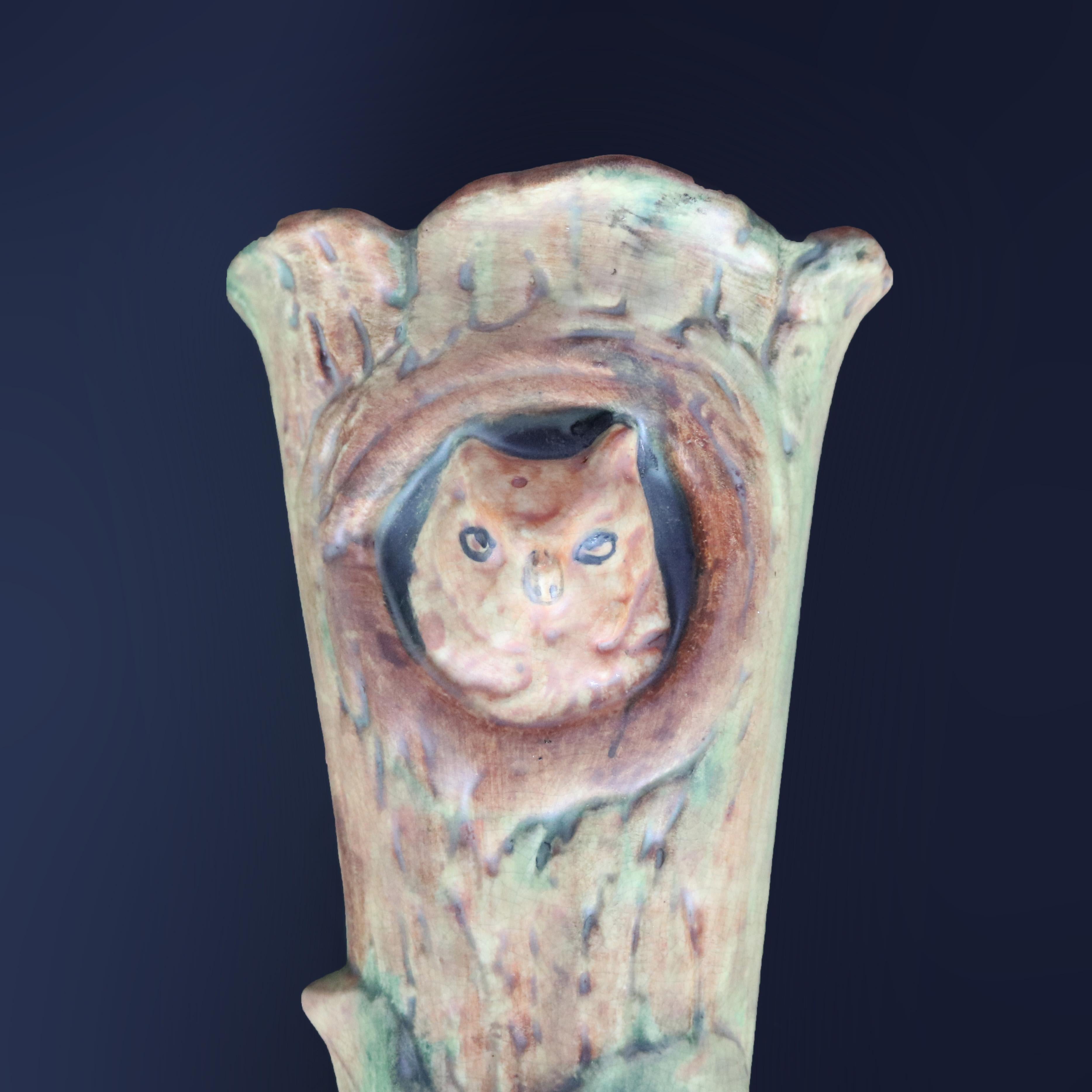 A vintage figural art pottery wall pocket by Weller of the Woodcraft line offers tree form vase with owl, unmarked, circa 1930

Measures: 11.25