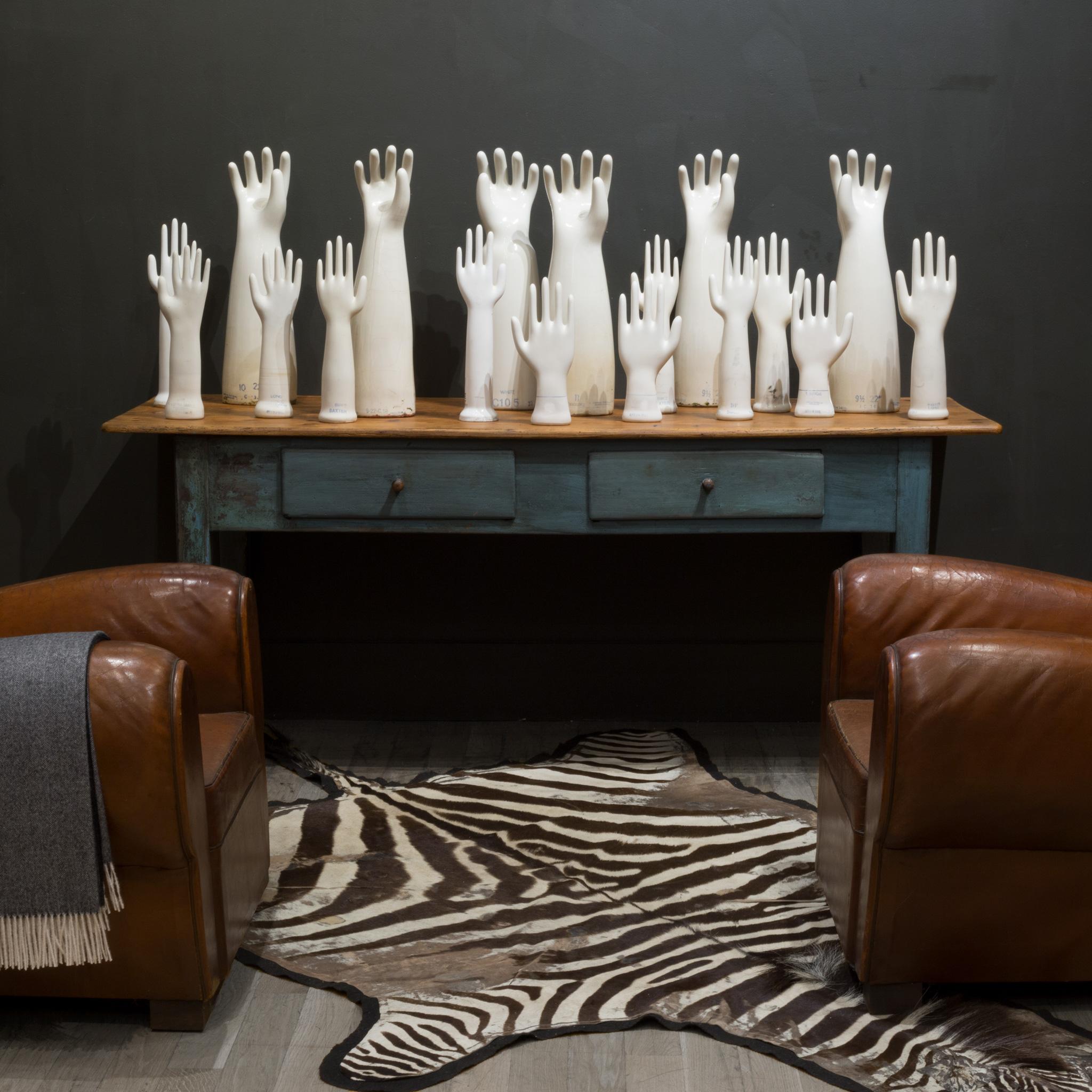 ABOUT

Price is per piece. Six extra large molds, four large, and eight medium molds available. See S16 Home San Francisco. 

Original West German glazed porcelain factory rubber glove molds with textured fingers. Each is stamped with the size