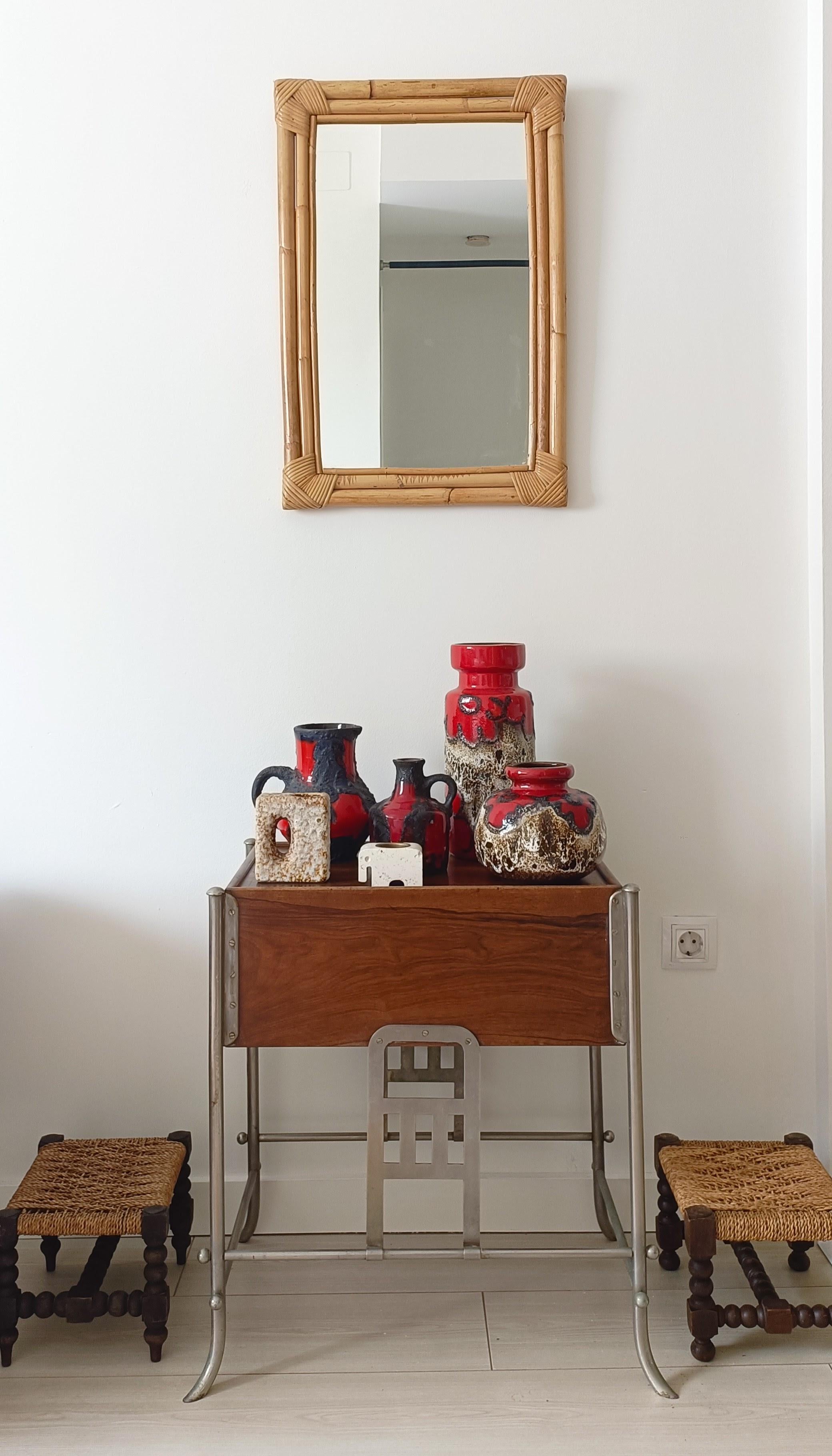 This cheerful beyond cool set of ceramic vases, designed by Oswald Kleudgen for Sheurich Keramik, showcases the iconic Fat Lava decor with the vibrant Red Daisies motif. Hand-produced in West Germany during the 1960s, this pieces embody the distinct