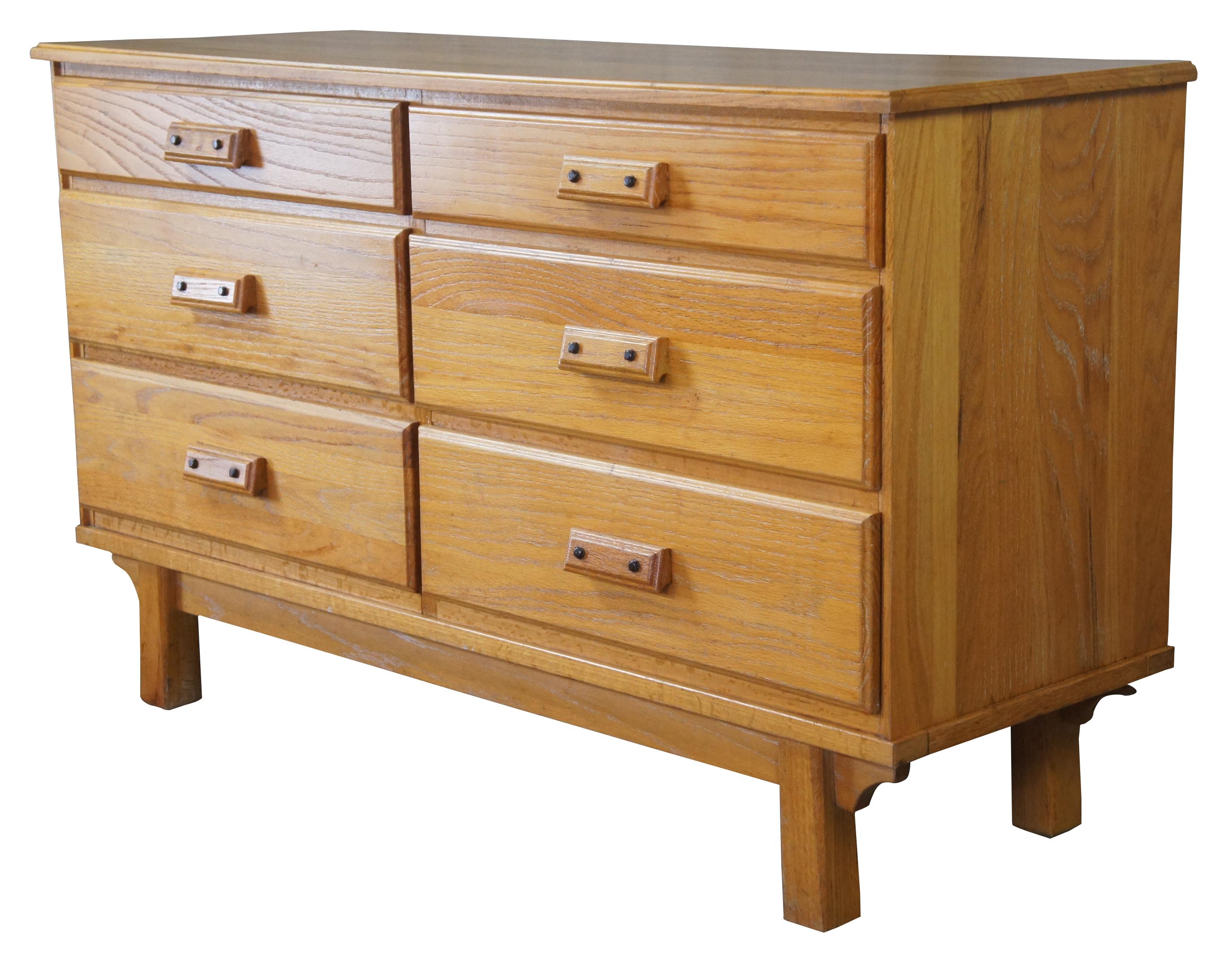 Desert oak double dresser by Westwood of Texas. Features a classic ranch style rectangular form with six drawers over a footed base. Measure: 52