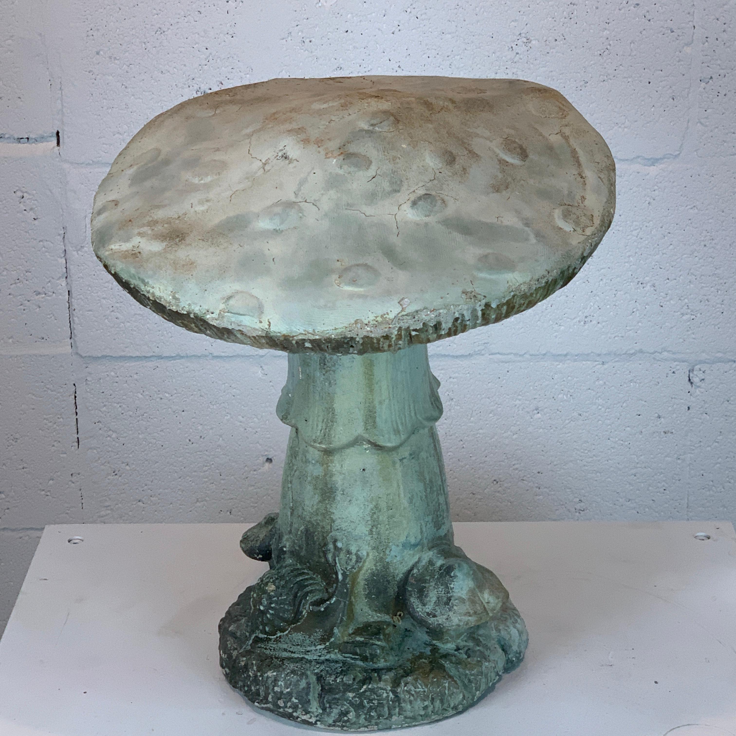 Vintage whimsical cast stone mushroom garden ornament, circa 1960
Realistically cast and modeled, with beautiful weathered verdigris patina.
Inscribed illegibly copyrighted numbered 2400.
Standing 16-inches high with a 13.5-inch diameter and a