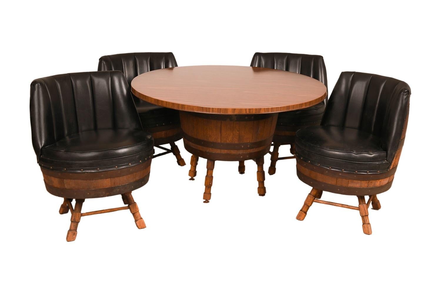 A stunning whiskey barrel table and chairs dining set.  Features a round tabletop resting on a barrel base with four stout legs creating an exceedingly sturdy base. Beautifully paired with four matching swivel chairs, each with black padded vinyl
