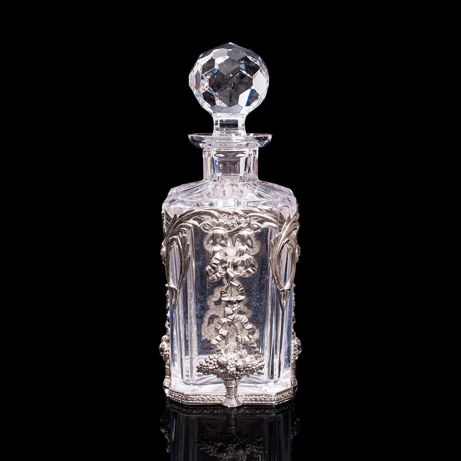 This is a vintage whiskey decanter. A Portuguese, glass spirit vessel with sterling silver filigree decoration, dating to the late 20th century, circa 1970.

Attractive decorative vessel for your finest spirits
Displaying a desirable aged patina