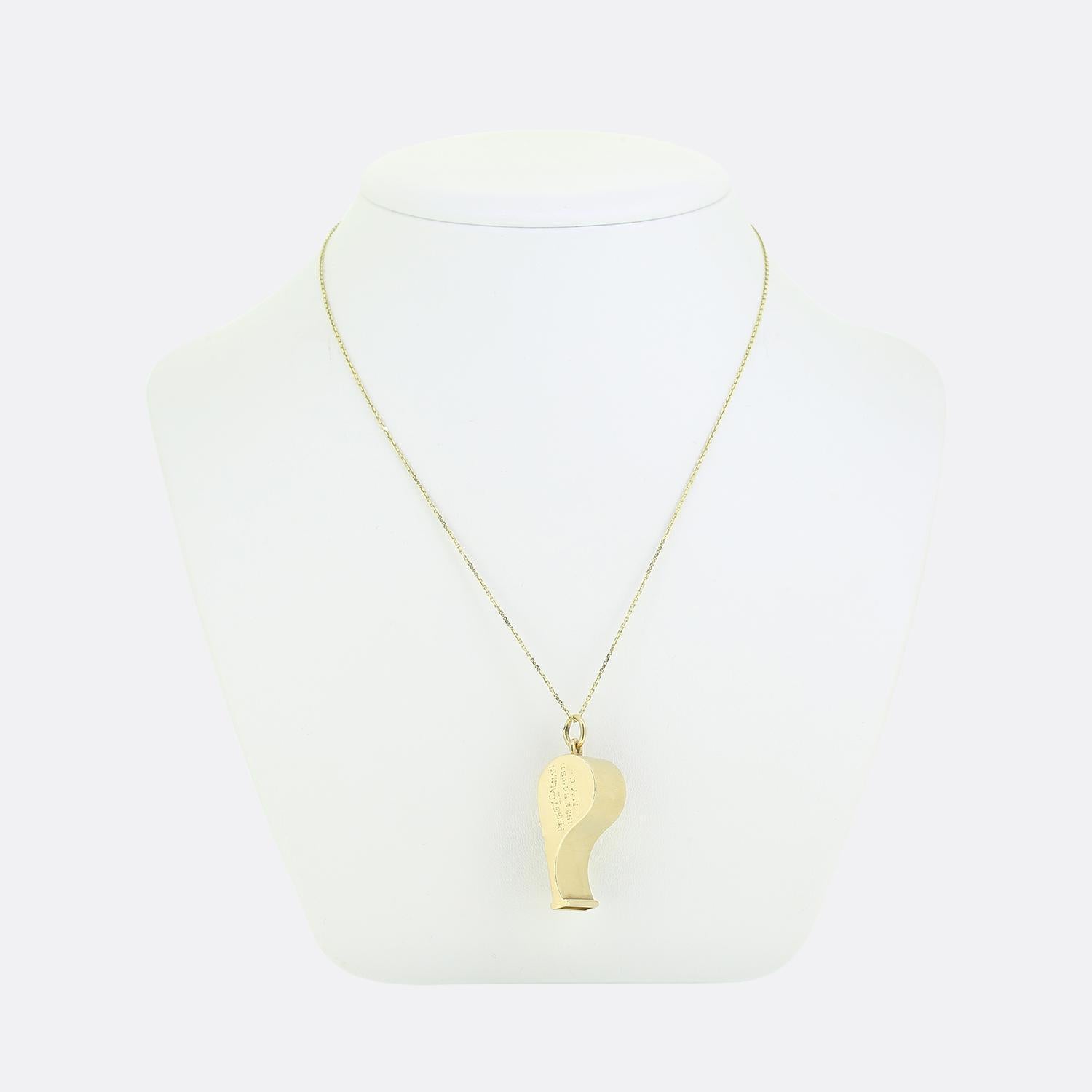Here we have a 14ct yellow gold whistle pendant necklace. The pendant has been crafted into the shape of a classic whistle (still in good working order) featuring smooth, polished surfaces and a sleek, minimalist design. The whistle hangs from a