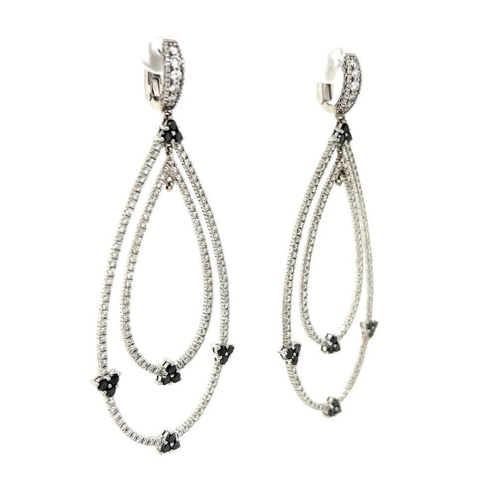 Simply Beautiful! White and Black Diamonds Open Double Hoop Pear Shape Design Drop Gold Earrings. Hand set with White and Black Diamonds, weighing approx. 3.90tcw. 286 Round Brilliant White Diamonds approx. 03.00tcw and 30 Round Black Diamonds