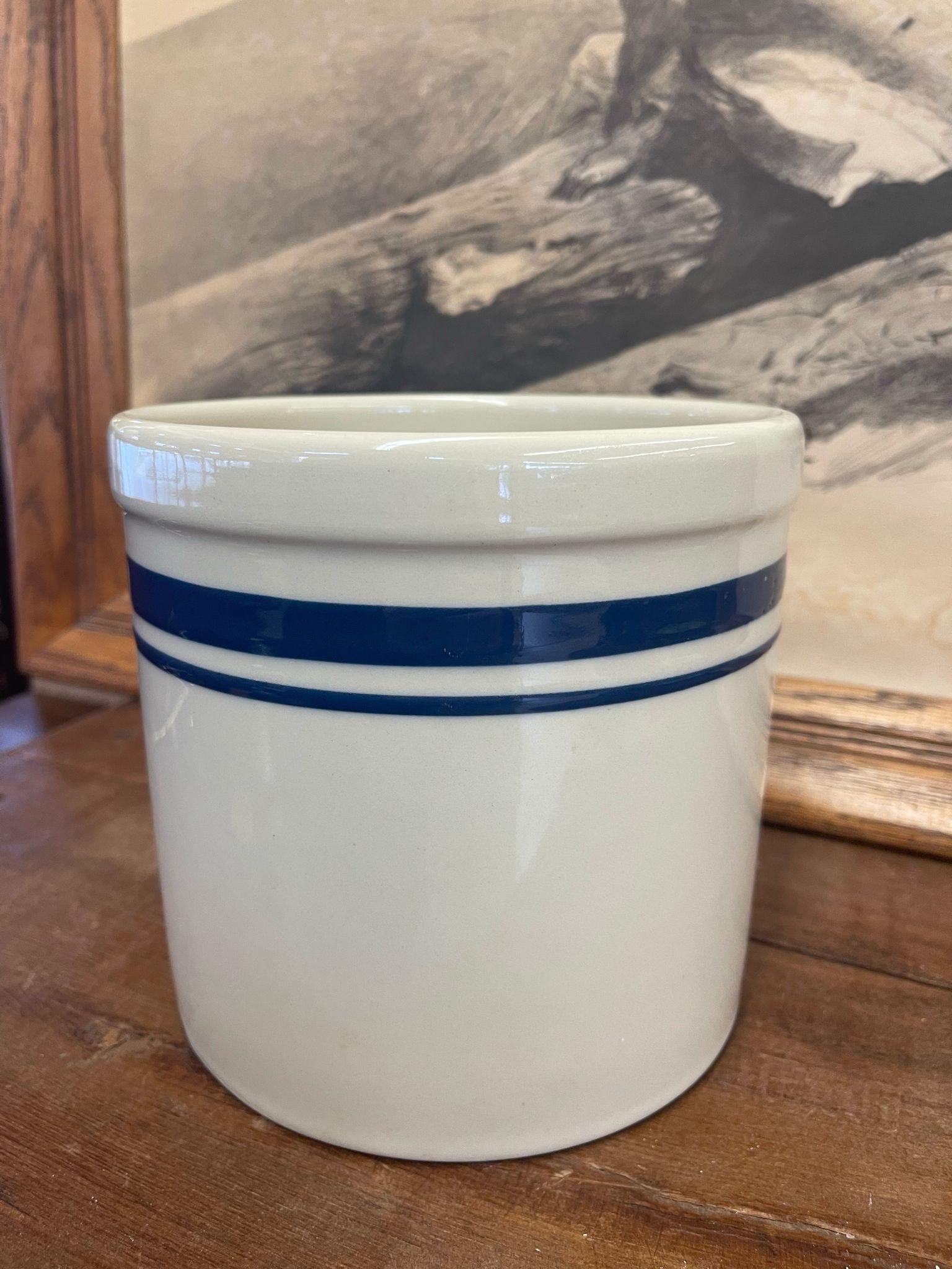 No Makers Mark. Ceramic Jar with Two Blue Stripes. Vintage Condition Consistent with Age as Pictured.

Dimensions. 7 Diameter; 6 H