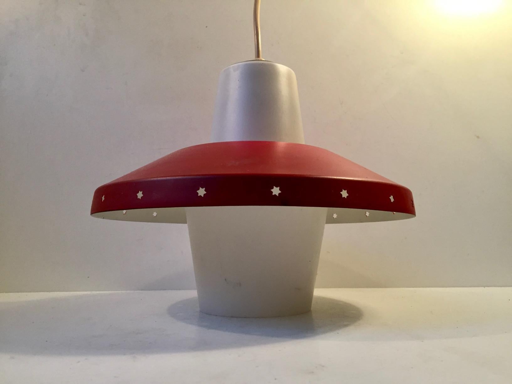 Danish ceiling light designed by Bent Karlby for Lyfa, Denmark and manufactured in the late 1950s. This design is often falsely attributed to Svend Aage Holm Sørensen. The light consists of red lacquered shade with perforated Stars to the edge and a