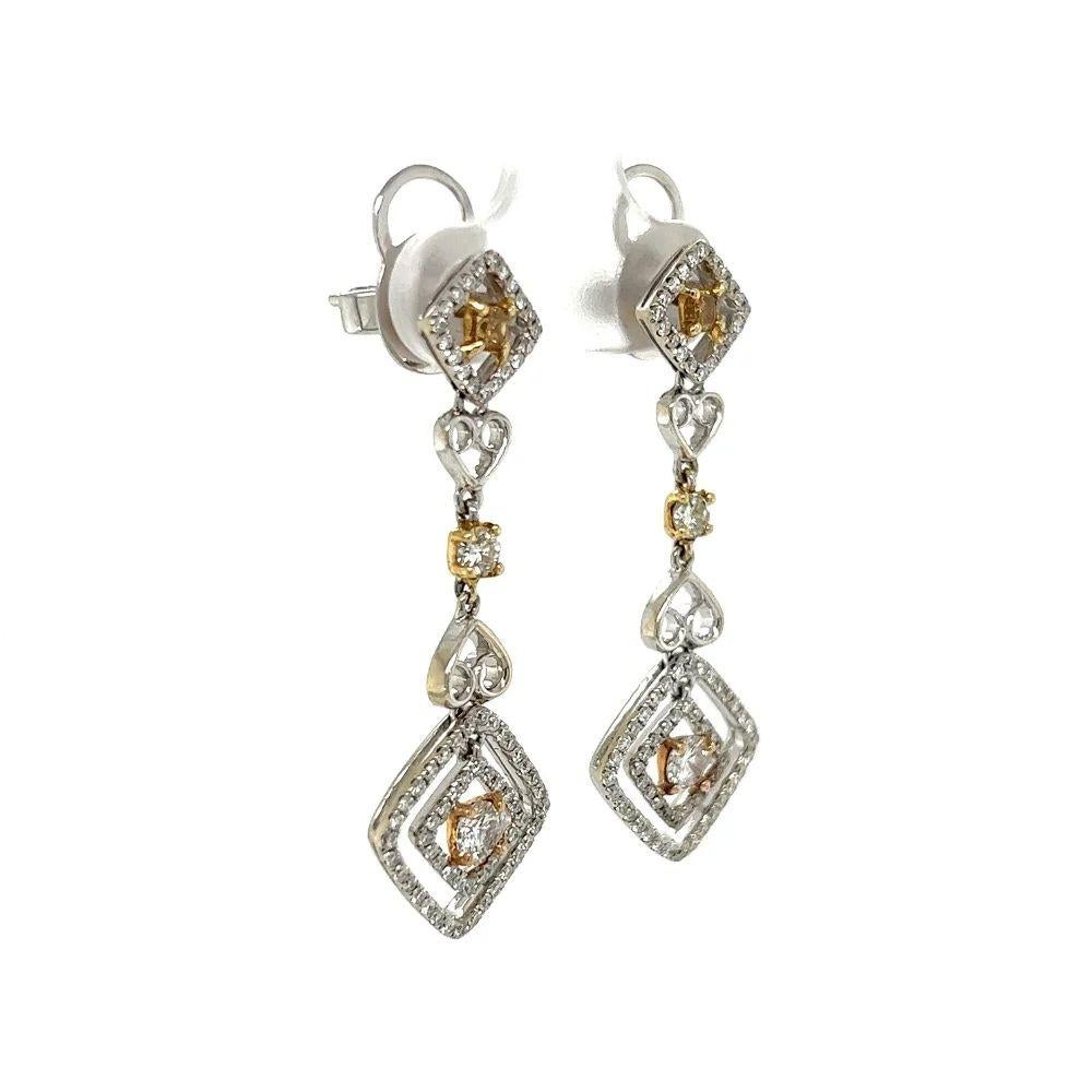 Simply Beautiful!  Vintage White and Yellow Diamond Drop 2-Tone Gold Earrings. Hand set with Diamonds, weighing approx. 1.56tcw. Measuring approx. 1.5” long. Beautifully Hand-crafted design in 2-Tone 18K Gold. Post and Butterfly system. More
