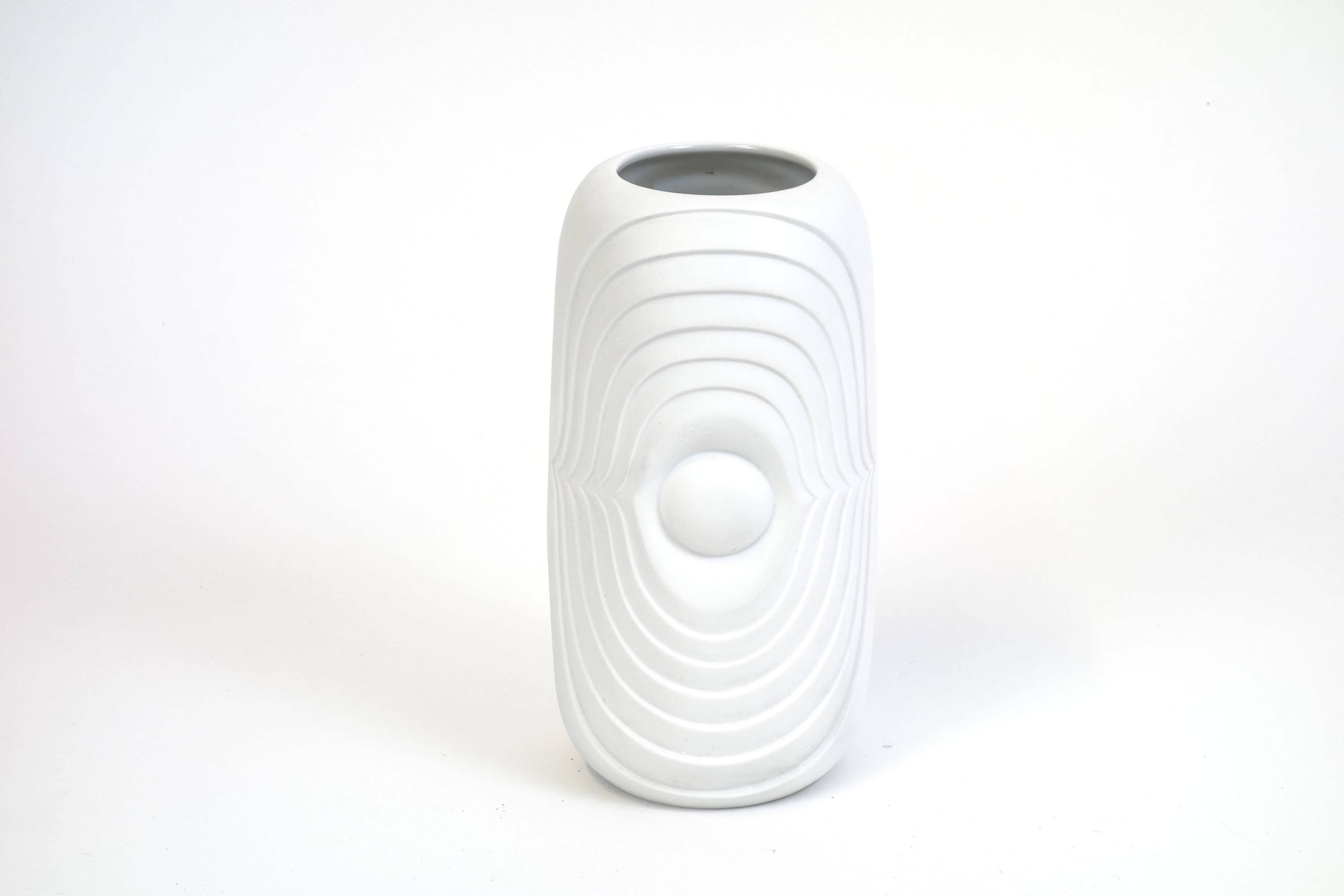 An exquisite vintage white bisque porcelain vase manufactured by KPM Berlin, Germany in the late 1960s. A significant statement of a time that breaks with traditional style without betraying its class. The frosted surface provides distinguished