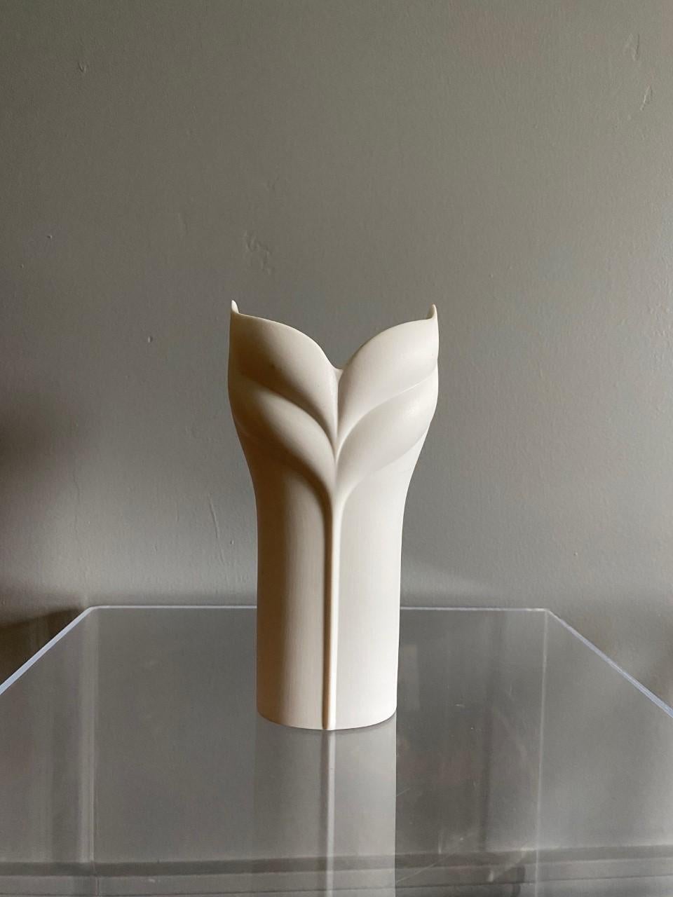 Beautiful and elegant white bisque op art vase by Uta Feyl for Rosenthal Studio linie. This graphic and romantic piece dates from the 1970s. The beautiful long lines along with the matte white finish give this piece lightness and timelessness. The