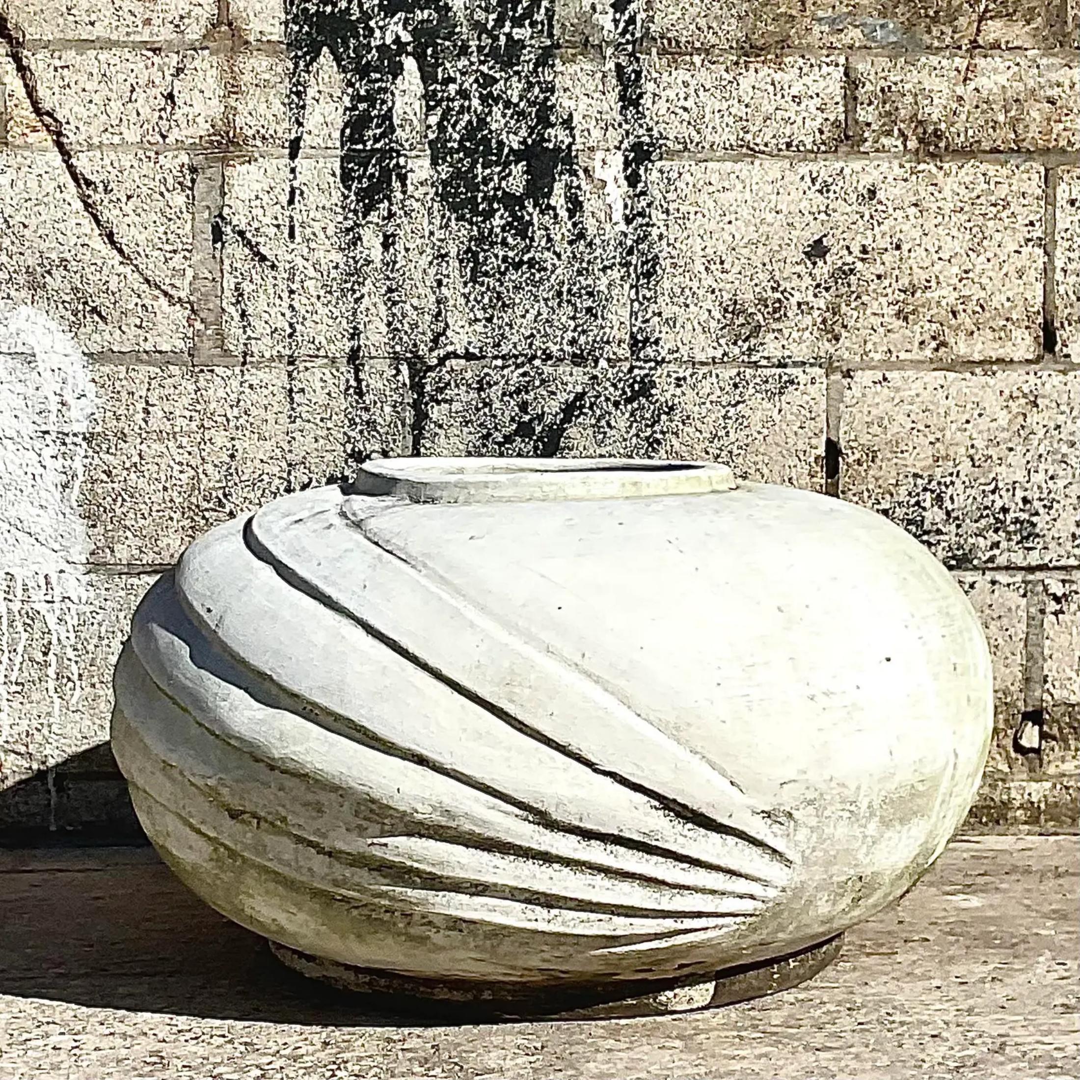 A gorgeous vintage white cement planter with ridges that can make your garden chic. Acquired at a Palm Beach estate.