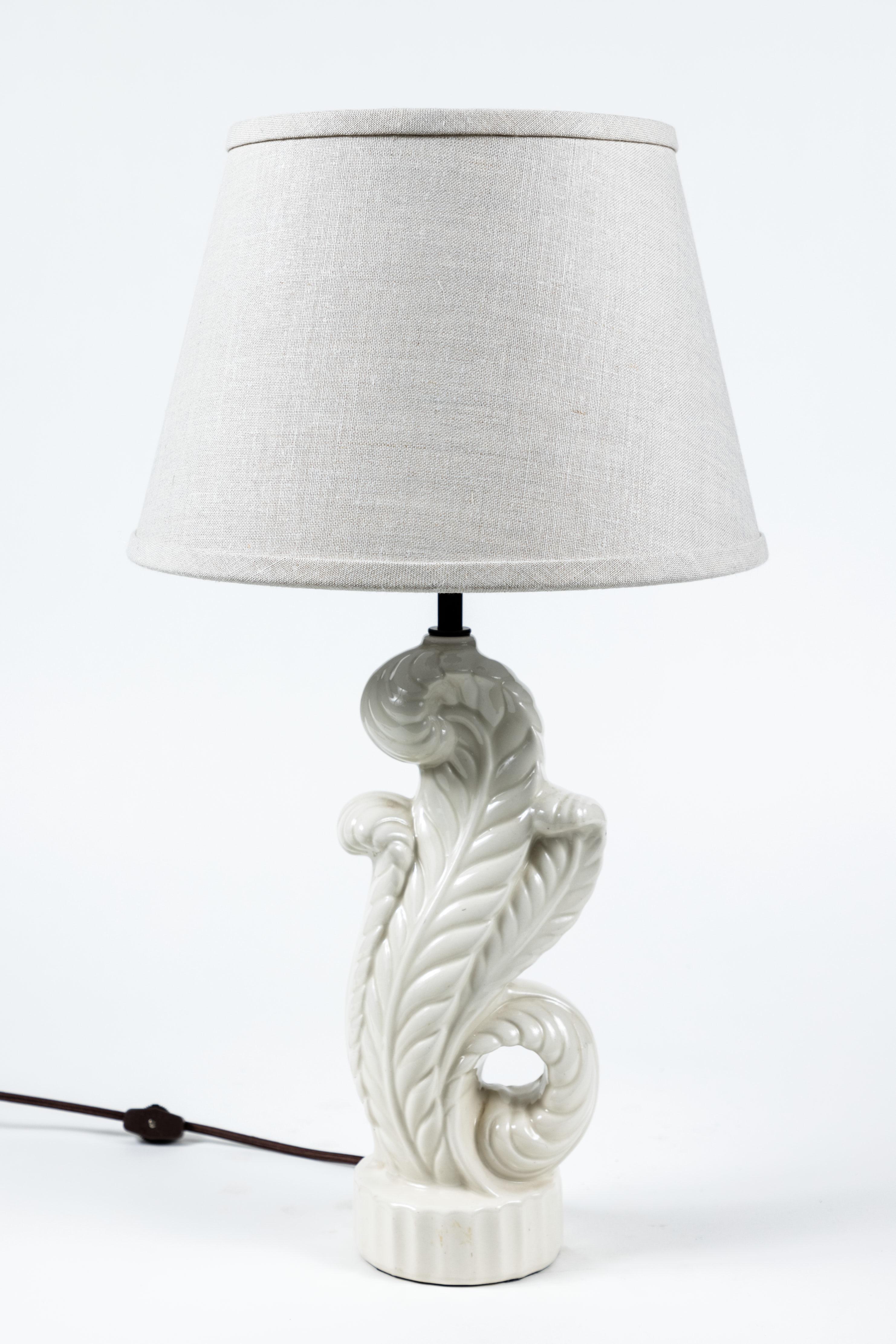 Vintage white pottery classic acanthus leaf lamp. Lamp has been newly rewired and has a new custom made linen shade.