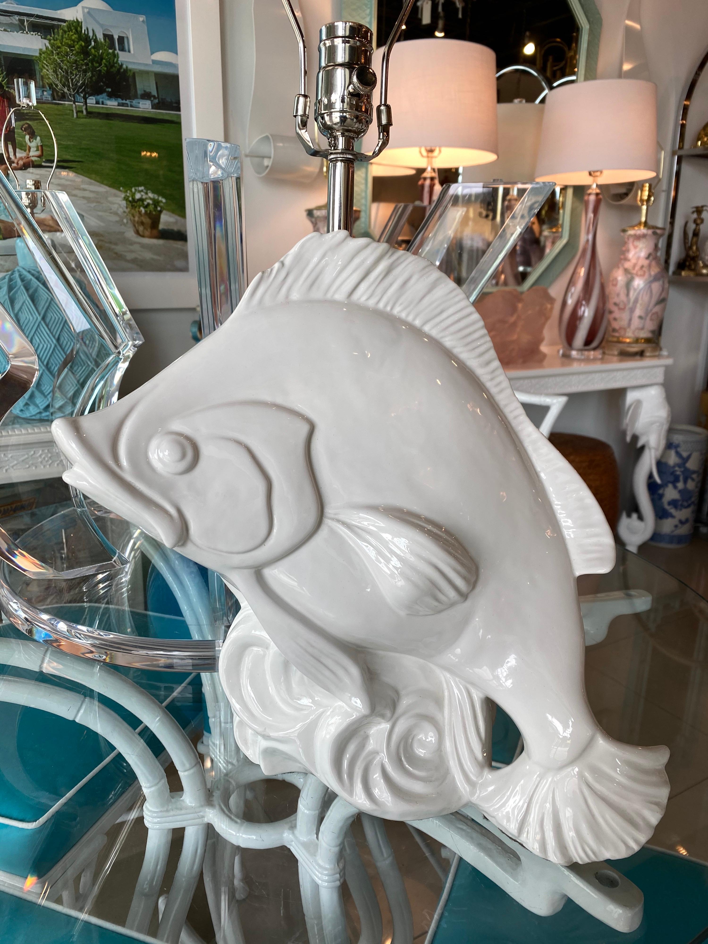 Lovely vintage white ceramic tropical fish table lamp. Newly wired with all new chrome 3 way sockets and hardware. Marked Made in Italy on lamp. Measures 18.5 H to socket top, 24.75 H to top of final.
