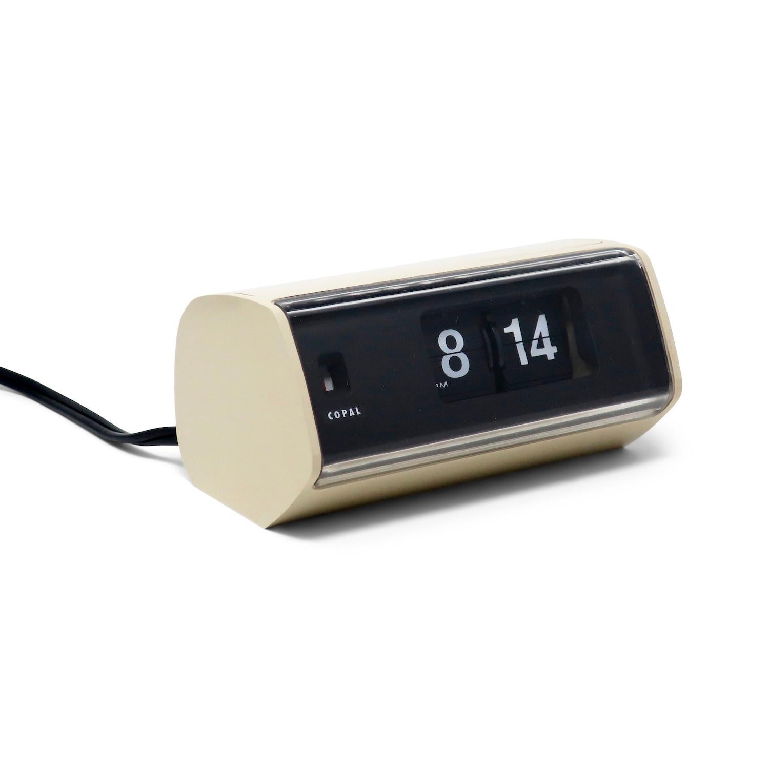 A Mid-Century Modern Copal Model 222 flip clock with off-white plastic case, black face, and clear plastic front. Minutes and hours flip as time passes, providing a satisfying quiet sound. Looks fantastic and works great!

In good vintage condition
