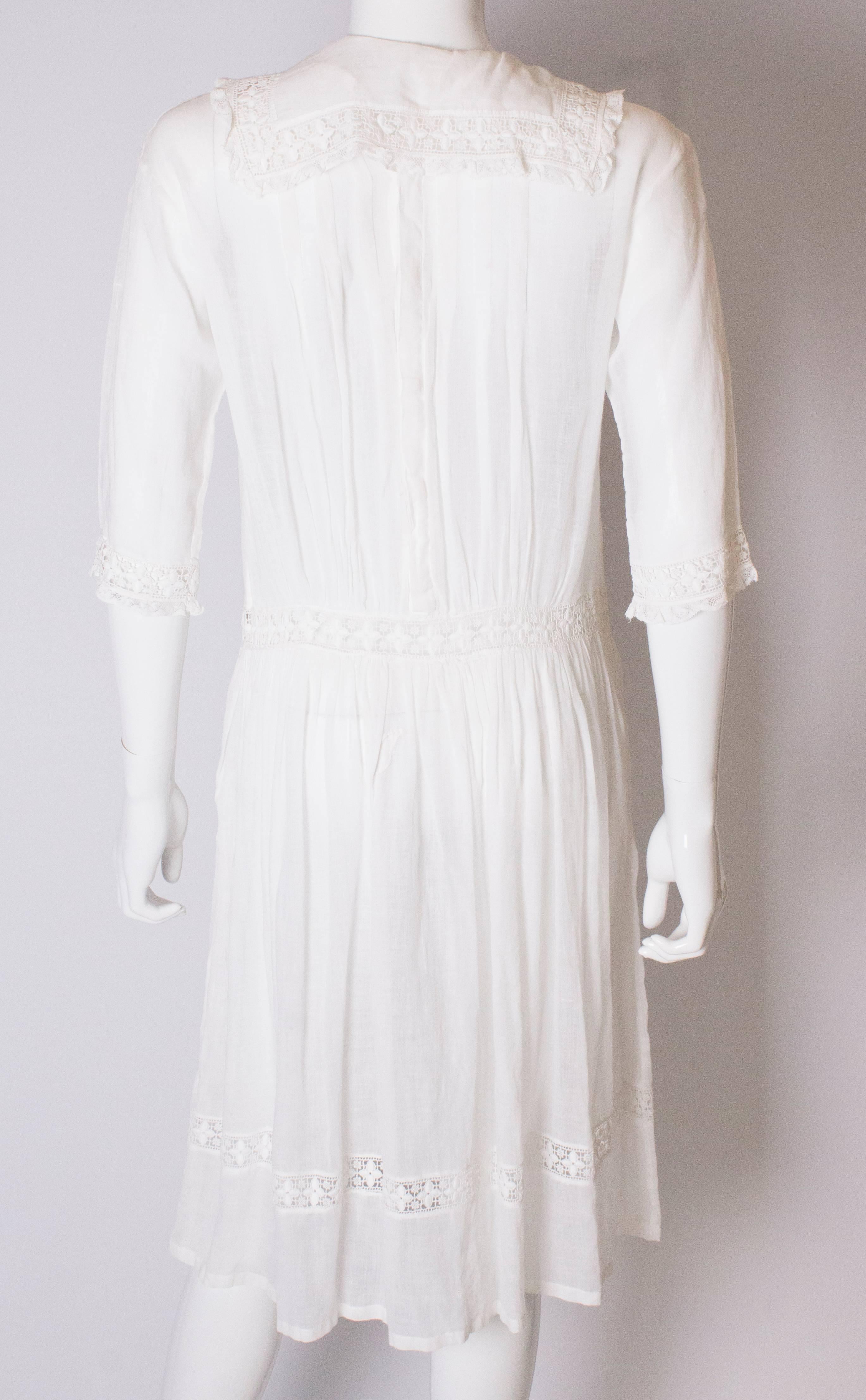 A Vintage edwardian lawn cotton dress with delicate embroidered flowers  2