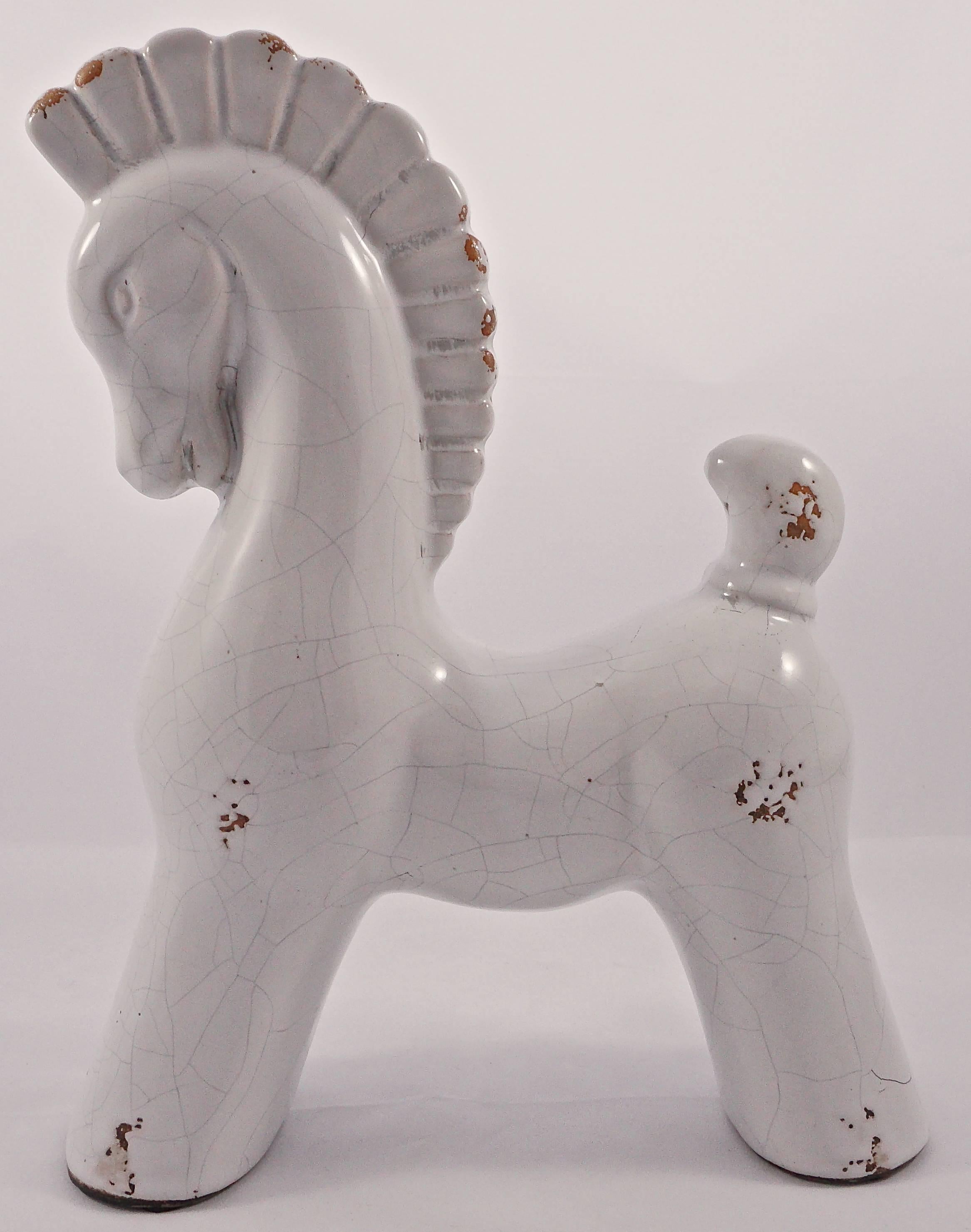 Stylized large white crackle glaze pottery horse, with speckling that exposes the ceramic beneath. It is in very good condition. The horse is height 27.2cm, 10.7 inches, width 22cm, 8.6 inches, and depth 7.6cm, 3 inches.

Do you know someone who