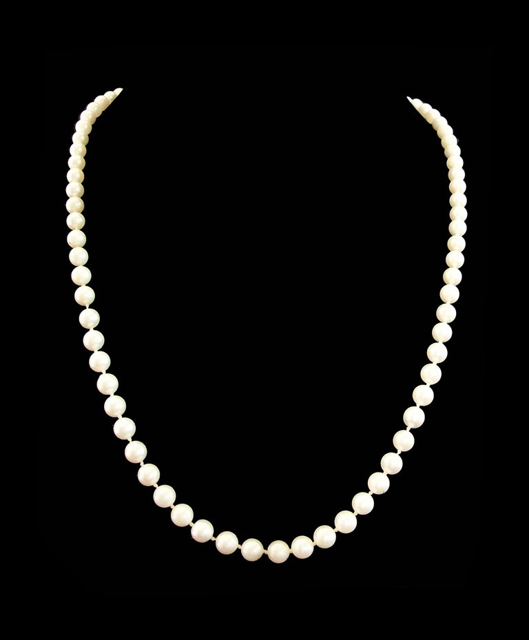 Vintage white cultured pearl strand necklace - 14K yellow gold clasp - 78 well matched pearls with cream overtone - 6.5 to 7.0 mm. diameter each - hand knotted assembly - signed 'LGC' on the clasp (unknown/unidentified maker) - Japan - circa