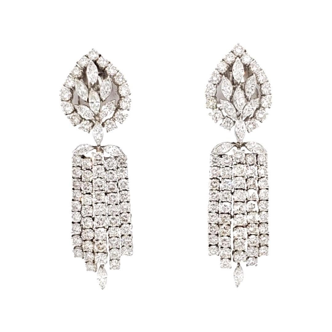 Vintage chandelier, detachable, diamond dangling earrings crafted in 18 karat white gold. These earrings are made with 124 round brilliant cut and marquise shape diamonds, F-G color and VS clarity. The bottoms are detachable, giving you two