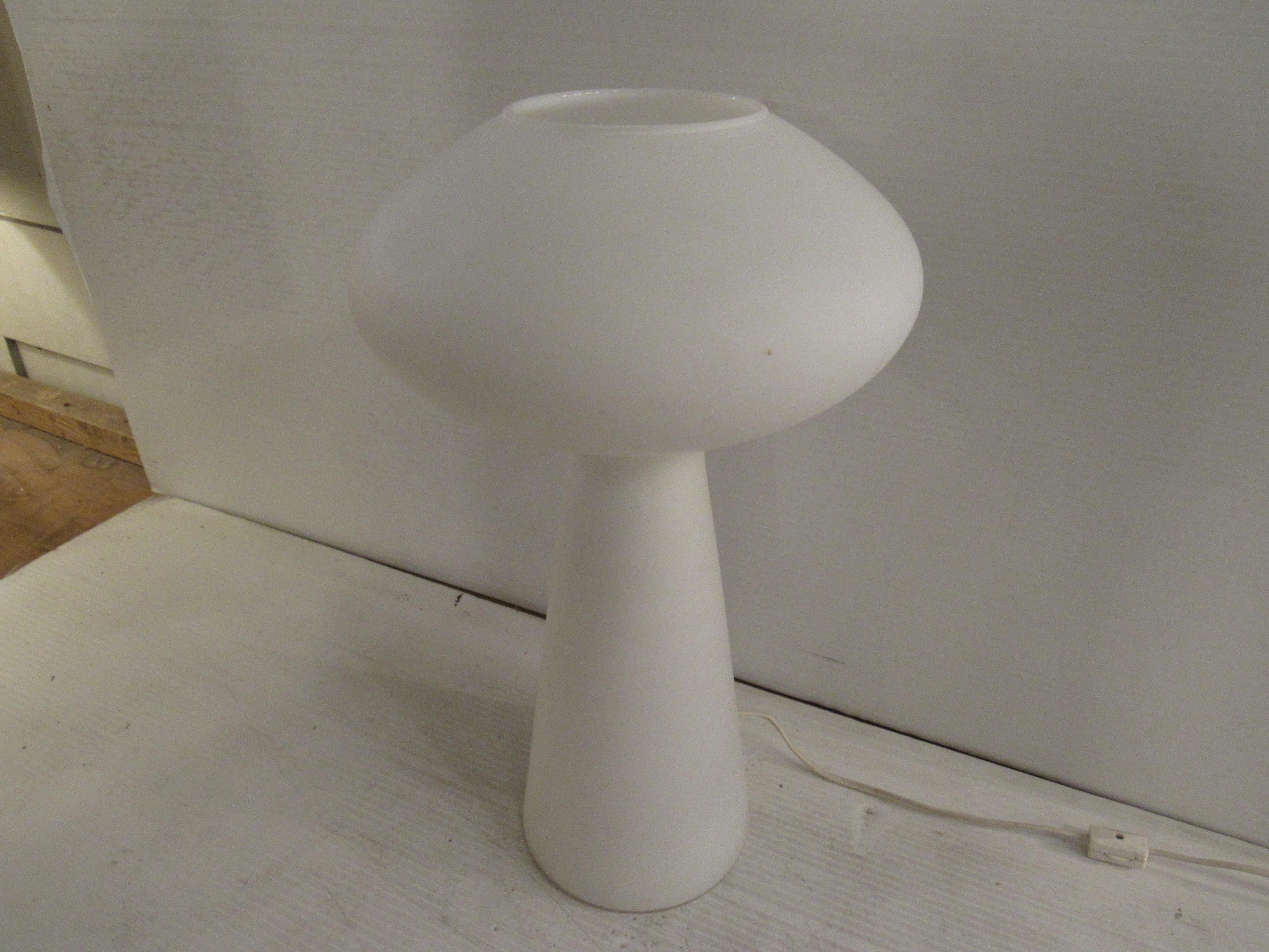 A cool, funky lamp sure to add a unique style to any room it's in. A white, frosted glass body gives off a soft glow while plugged in. Perfect for a desk, nightstand, or side table. 

(Please confirm item location - NY or NJ - with dealer).