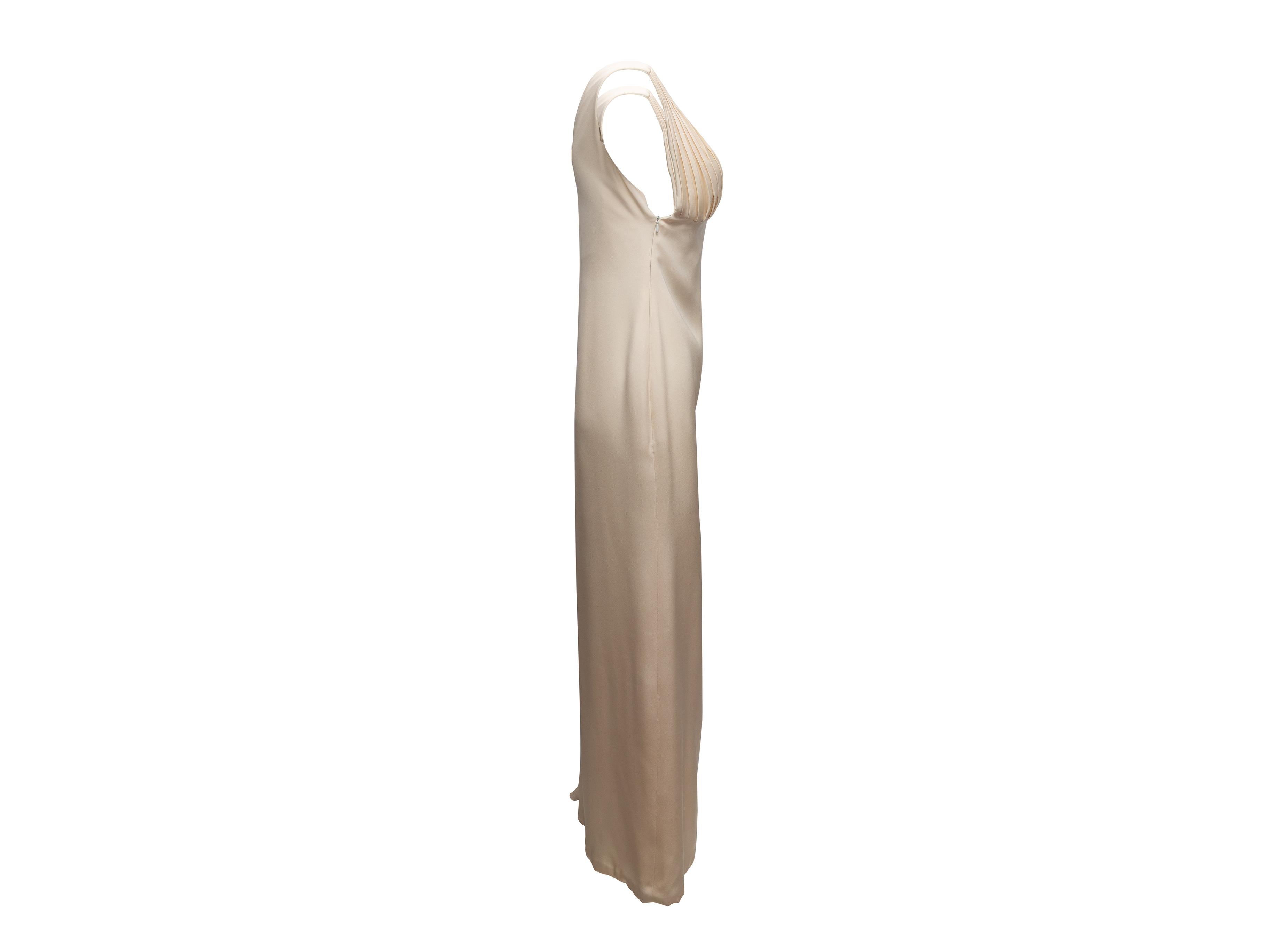 Vintage white sleeveless gown by Gianni Versace Couture. Circa 1990s. V-neck. Pleating at bust and side. Zip closure at side. 26
