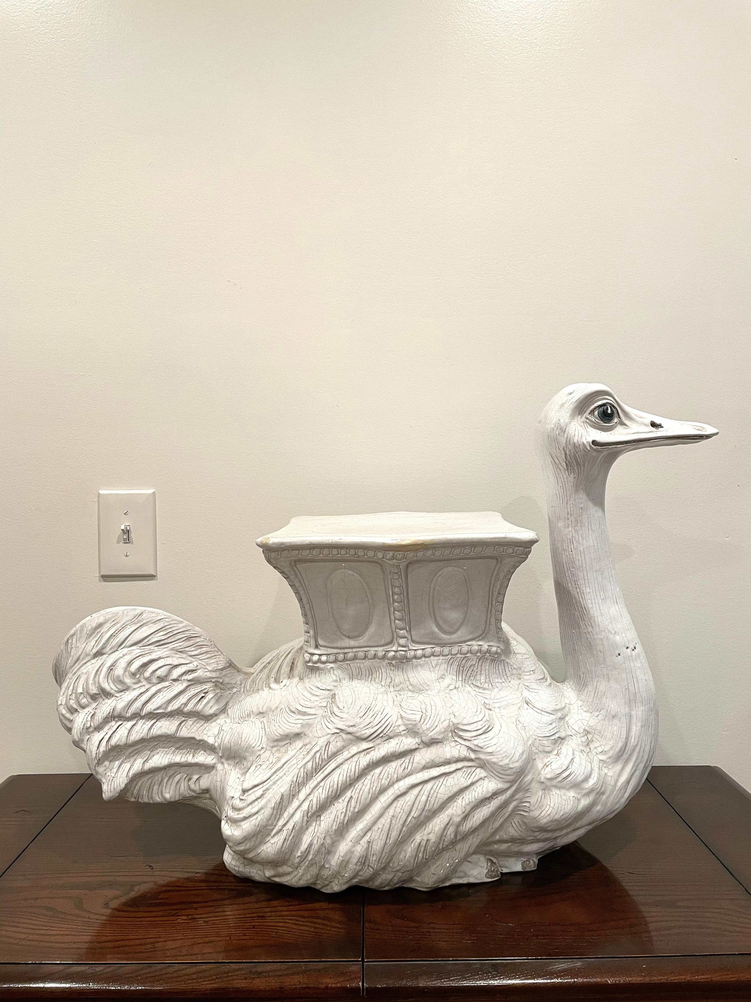 Classic whimsical Italian white glazed terracotta garden seat or garden stool of an ostrich. This blanc de chine garden ornament can be used indoors or outdoors as a side table or end table. A versatile Italian Hollywood Regency piece that would