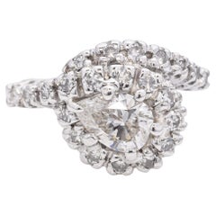 Anello aureola in oro bianco vintage con diamante a pera da 0,75 carati e diamanti a spirale
