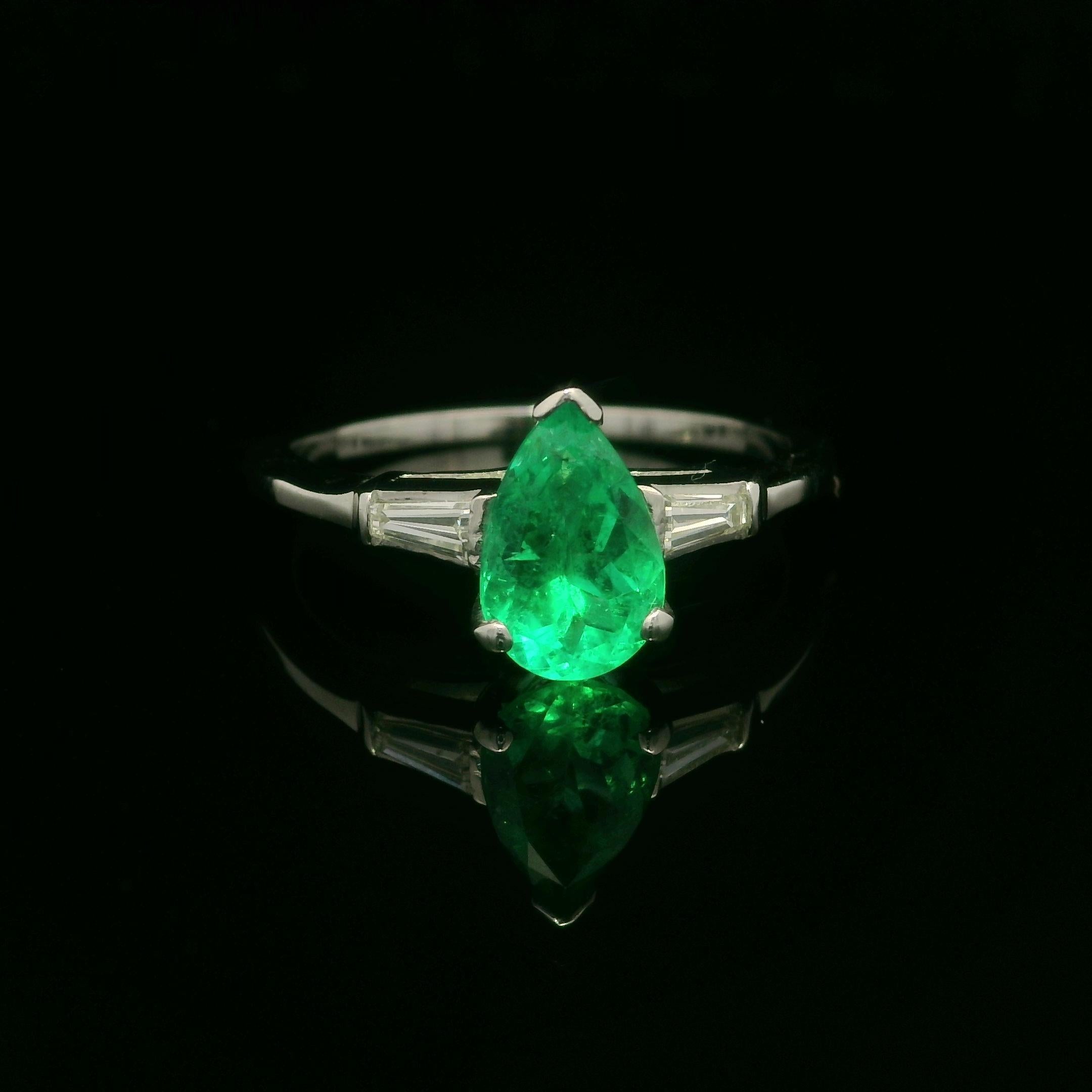 --Stone(s):--
(1) Natural Genuine Emerald - Pear Cut - Prong Set - Very Brilliant Nice Green Color - 9x6mm - 1.25ct (approx.)
(2) Natural Genuine Diamonds - Baguette Cut - Channel Set - G/H Color - VS1/VS2 Clarity - 0.24ctw (approx.)
Total Carat