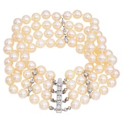 Bracelet vintage à 4 rangées de perles et diamants