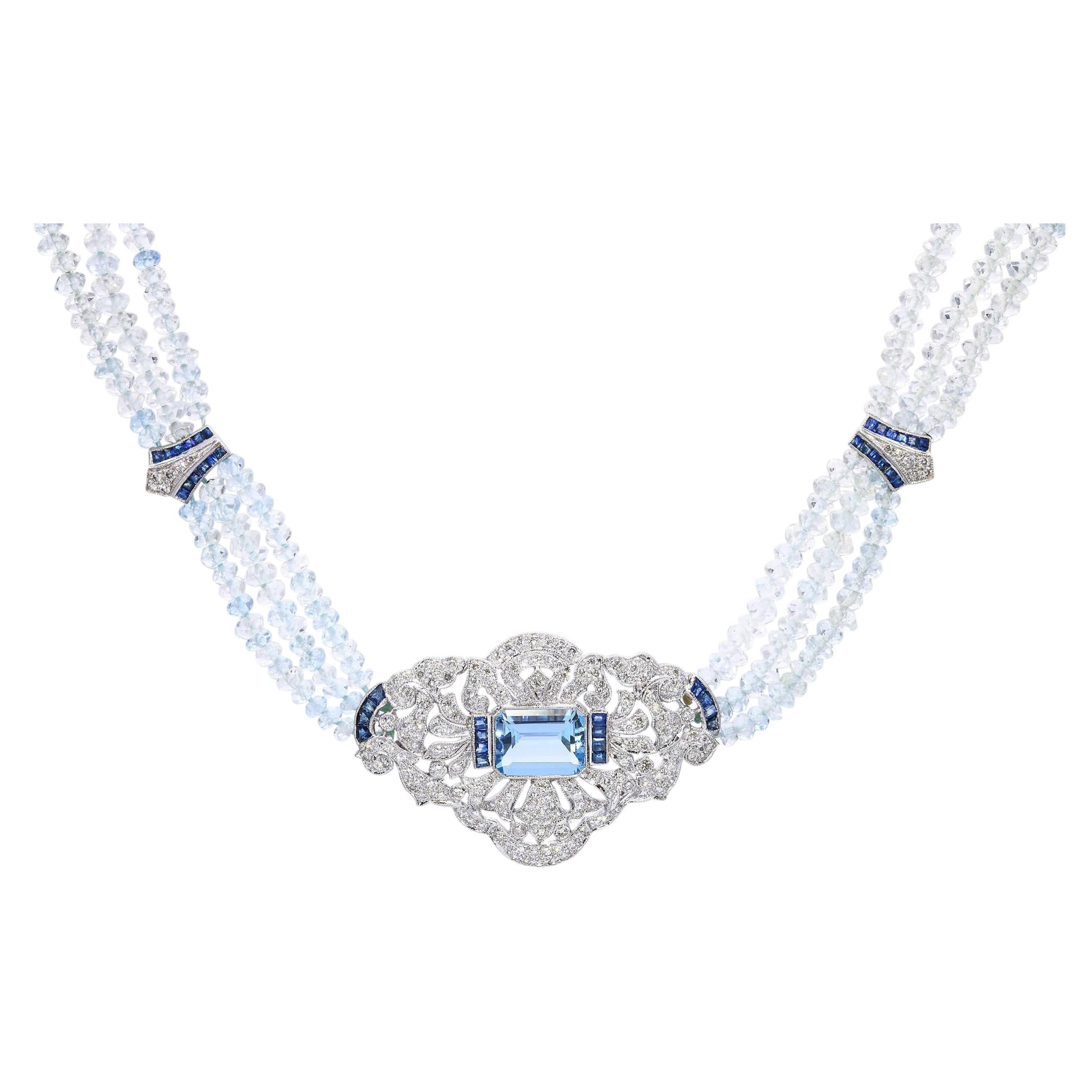 Collier Vintage en or blanc avec aigue-marine, diamant et saphir.