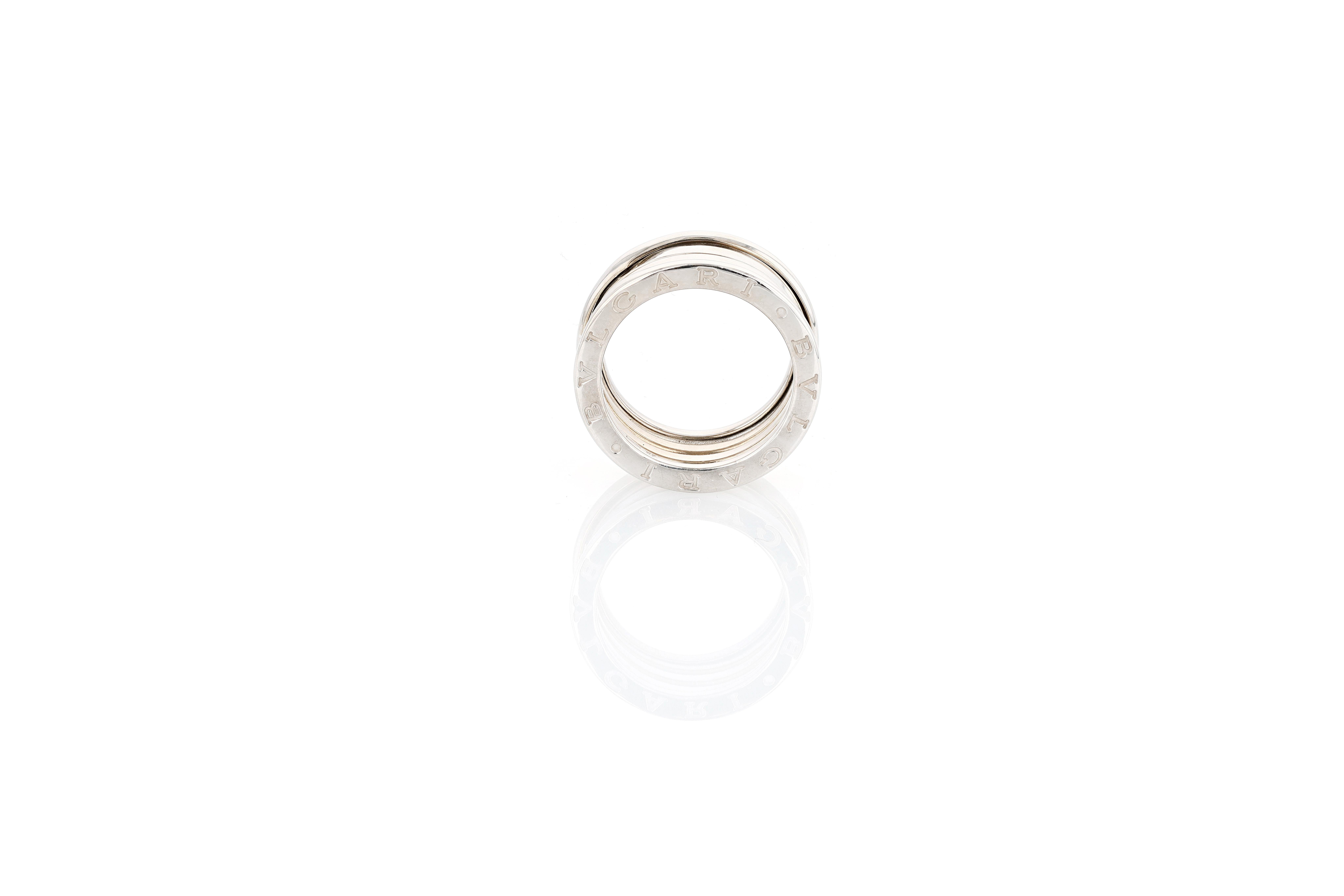 A vintage Bulgari B-Zero ring in 18 karat white gold.
This example is the widest three-row version of the B-Zero and as such features the coveted spring mechanism which allows the ring to expand and contract when squeezed and released.

Since its
