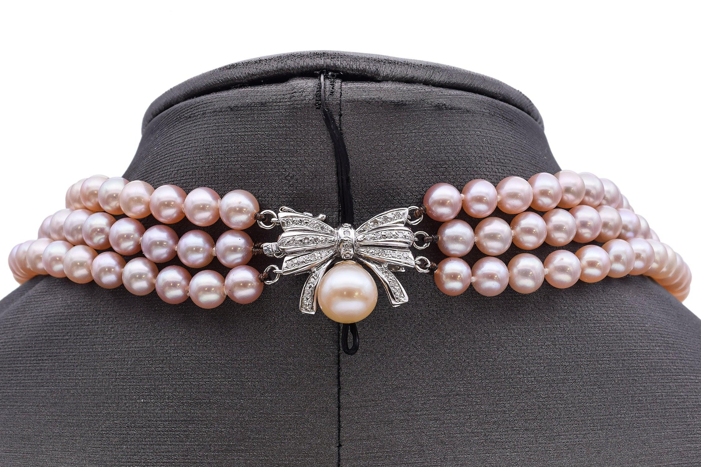 Conjunto de collar y pulsera vintage de perlas con lazo de diamantes en oro blanco en Bueno estado para la venta en New York, NY