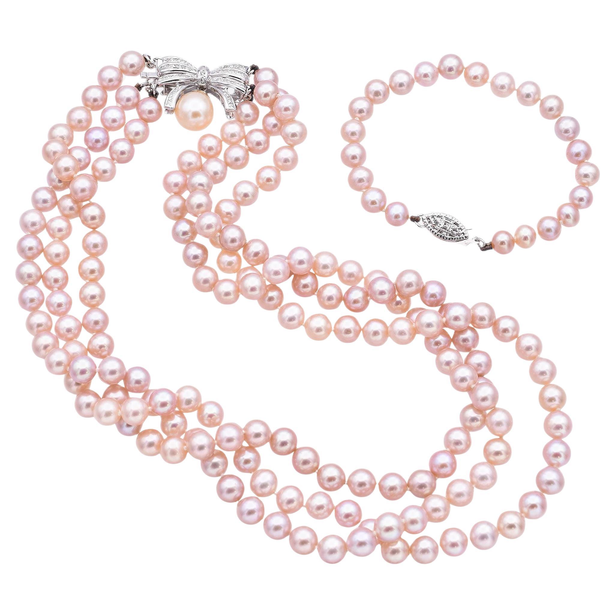 Conjunto de collar y pulsera vintage de perlas con lazo de diamantes en oro blanco en venta