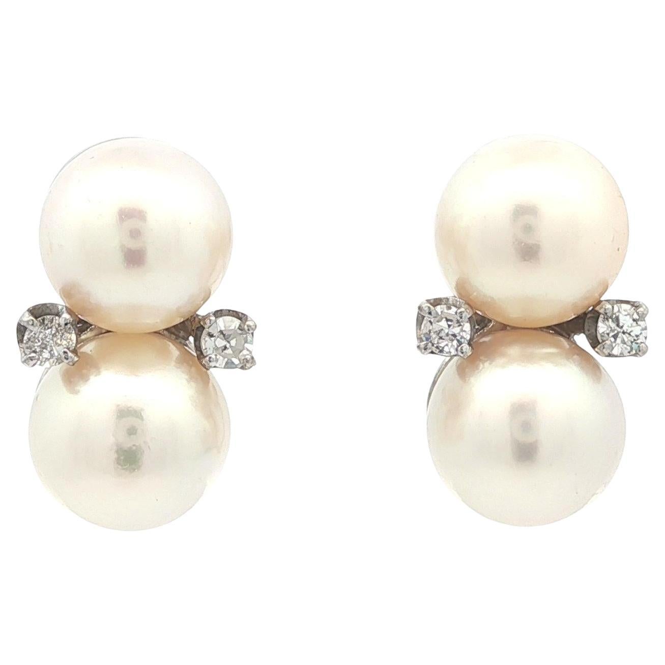 Orecchini vintage in oro bianco con doppia perla e diamanti con chiusura a vite