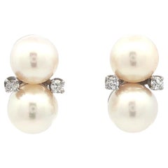 Orecchini vintage in oro bianco con doppia perla e diamanti con chiusura a vite