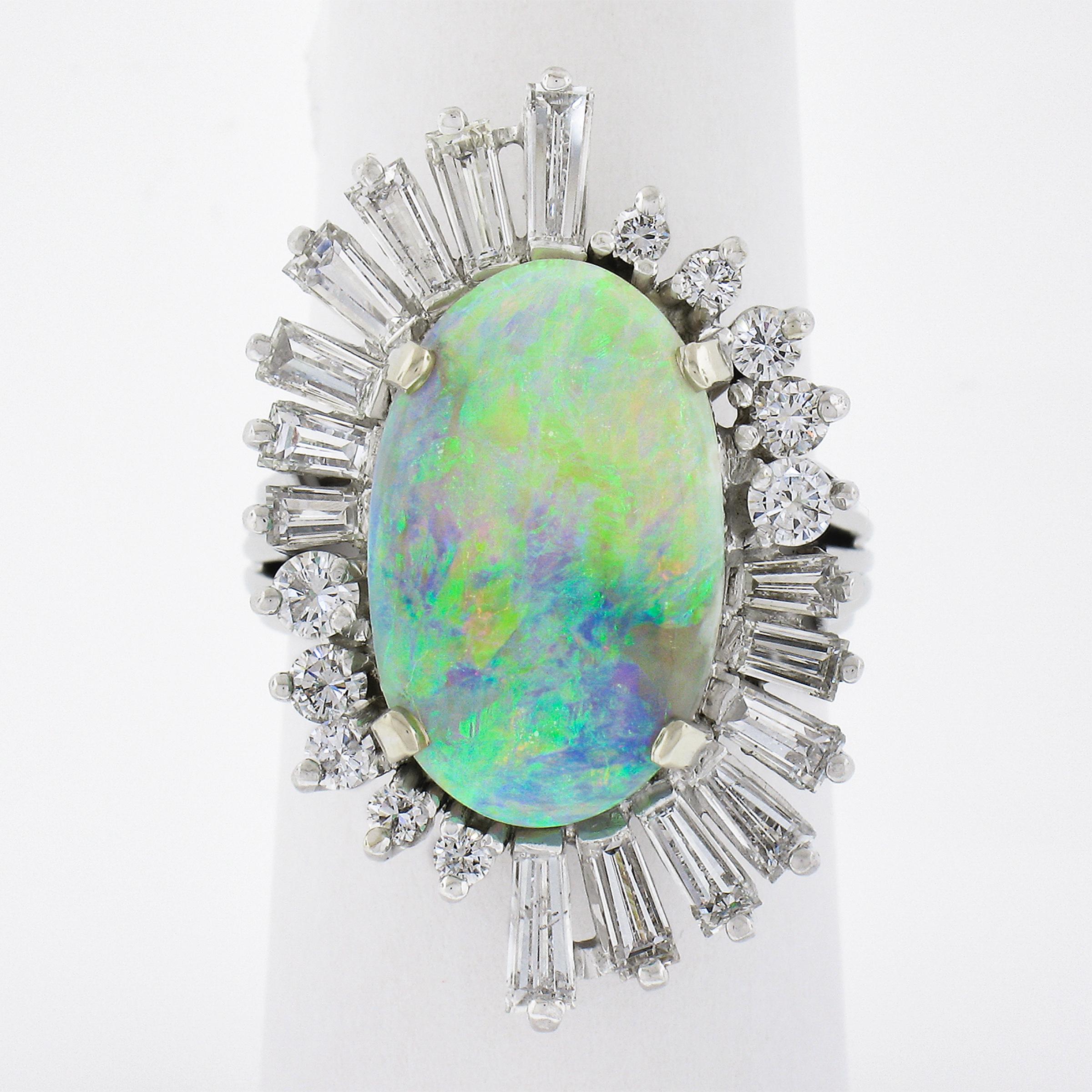 This very fine quality, elongated oval cabochon opal is absolutely magnificent and on fire! It displays sparks and play of purple, yellow, orange, green and red play of color in every lightning condition. Whether you're indoors or enjoying an