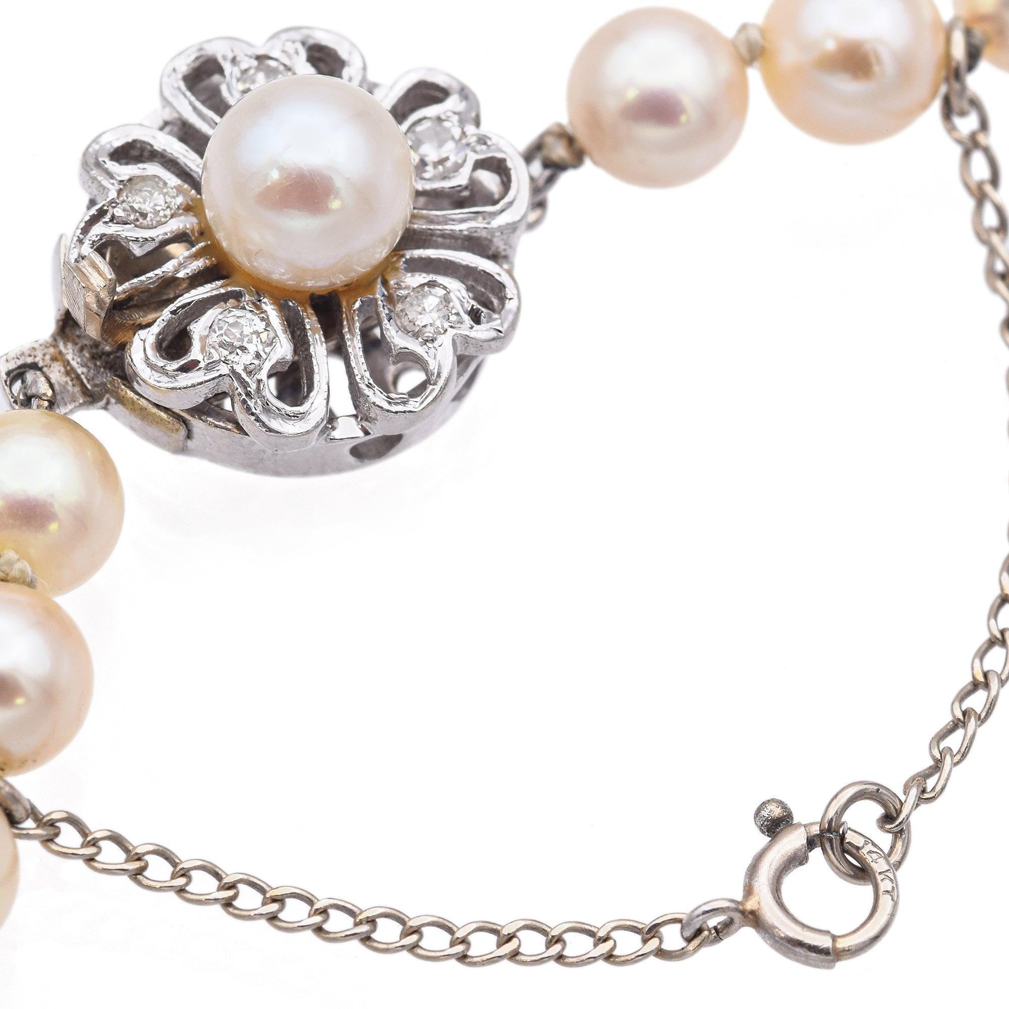 Round Cut Vintage White Gold Pearl and Diamond Floral Clasp Beaded Strand Necklace For Sale
