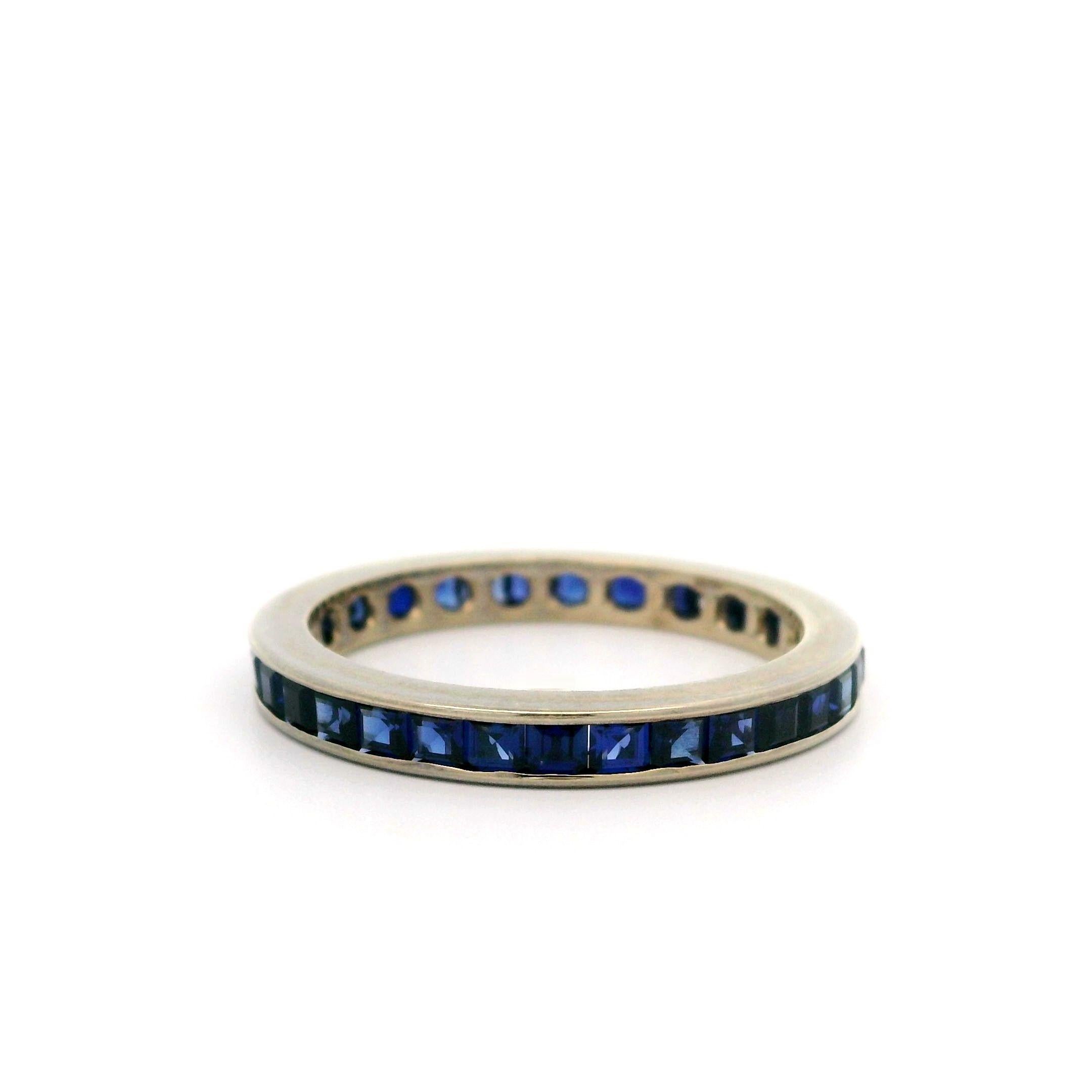 –Stone(s)–
Numerous Synthetic Sapphires - Square Step Cut - Channel Set - Royal Blue Color - 2.1mm (approx.)

Material: Solid 14k White Gold
Weight: 2.21 Grams
Ring Size: 7.0 ( fitted on finger, item can NOT be sized)
Ring Width: 2.7mm (0.10