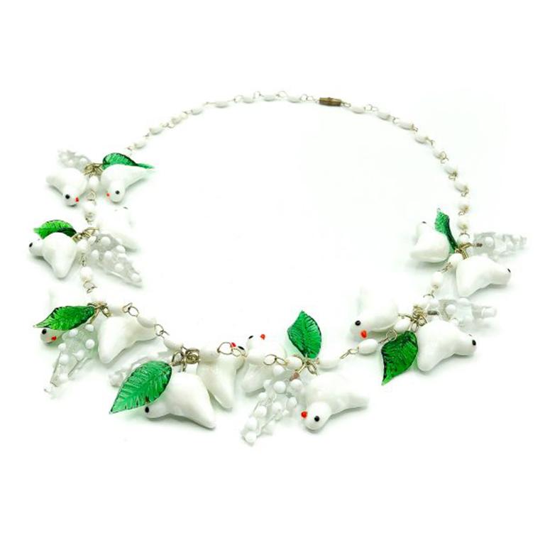 A beautiful Vintage Glass Bird Necklace. Originally produced in the 1950s this style of necklace was hugely popular. This is a later version inspired by those pieces. The upside is it is a little more robust. The entire necklace created in glass.