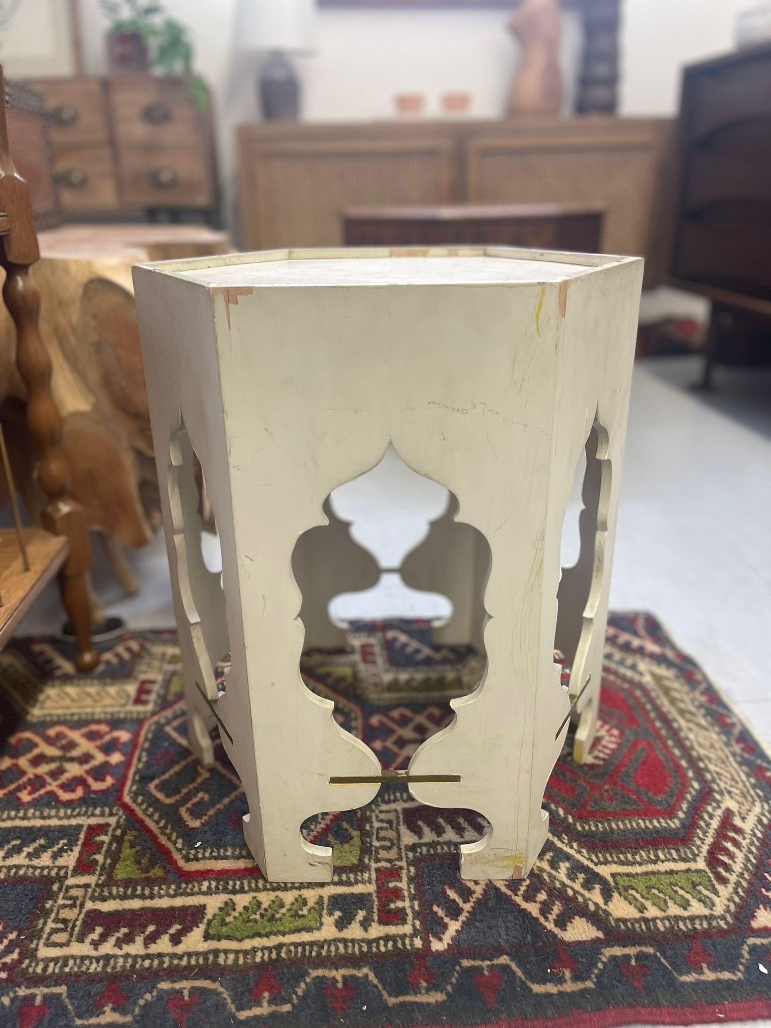Accent Table with Unique Wood Carvings. Metal Inserts on each Side. Vintage Condition Consistent with Age as Pictured.

Dimensions. 14 W ; 14 D ; 18 H