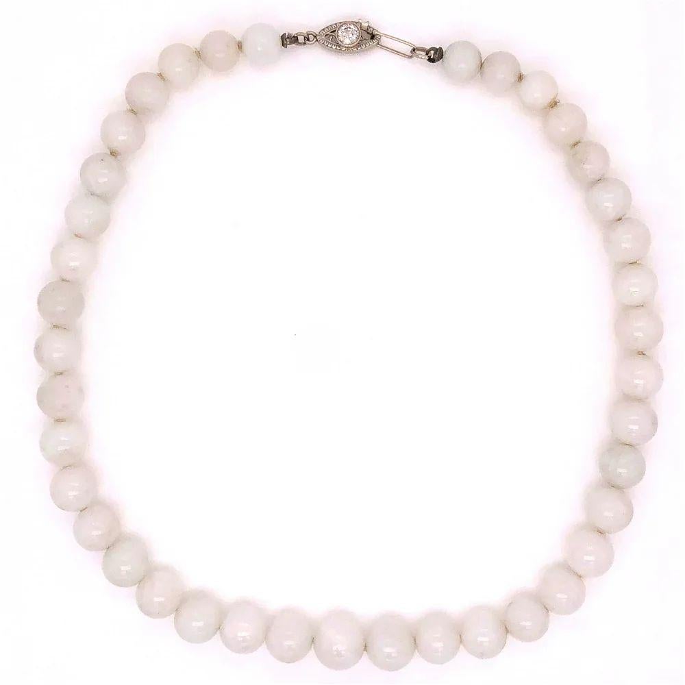 Simply Beautiful! White Jade GIA and Diamond clasp Gold Necklace. Each bead measuring approx. 6.5-9.5mm. Held by a 14K White Gold clasp, hand set with a Brilliant Diamond, weighing approx. 0.40 Carat. Necklace Hand strung with matching Silk cord.