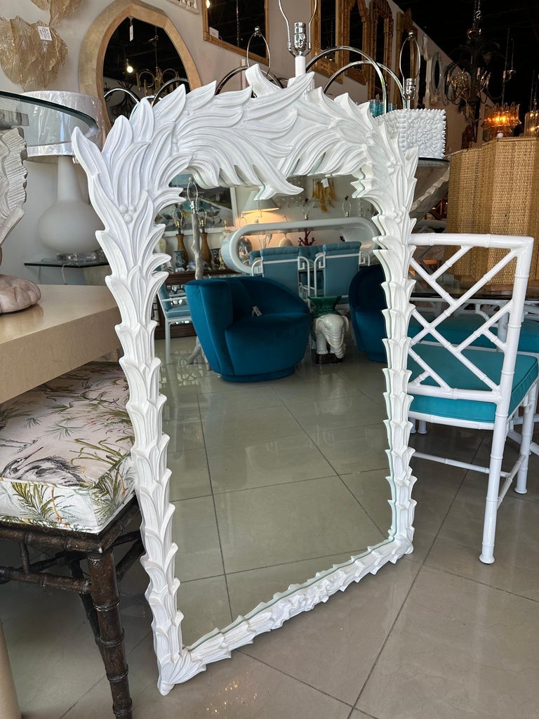 Beautiful vintage Palm Beach tropical palm frond leaf tree leaves wall mirror in the style of Serge Roche. Newly lacquered in a soft satin white. Comes ready to hang. Dimensions: 48 H x 31.5 W x 1 D.
