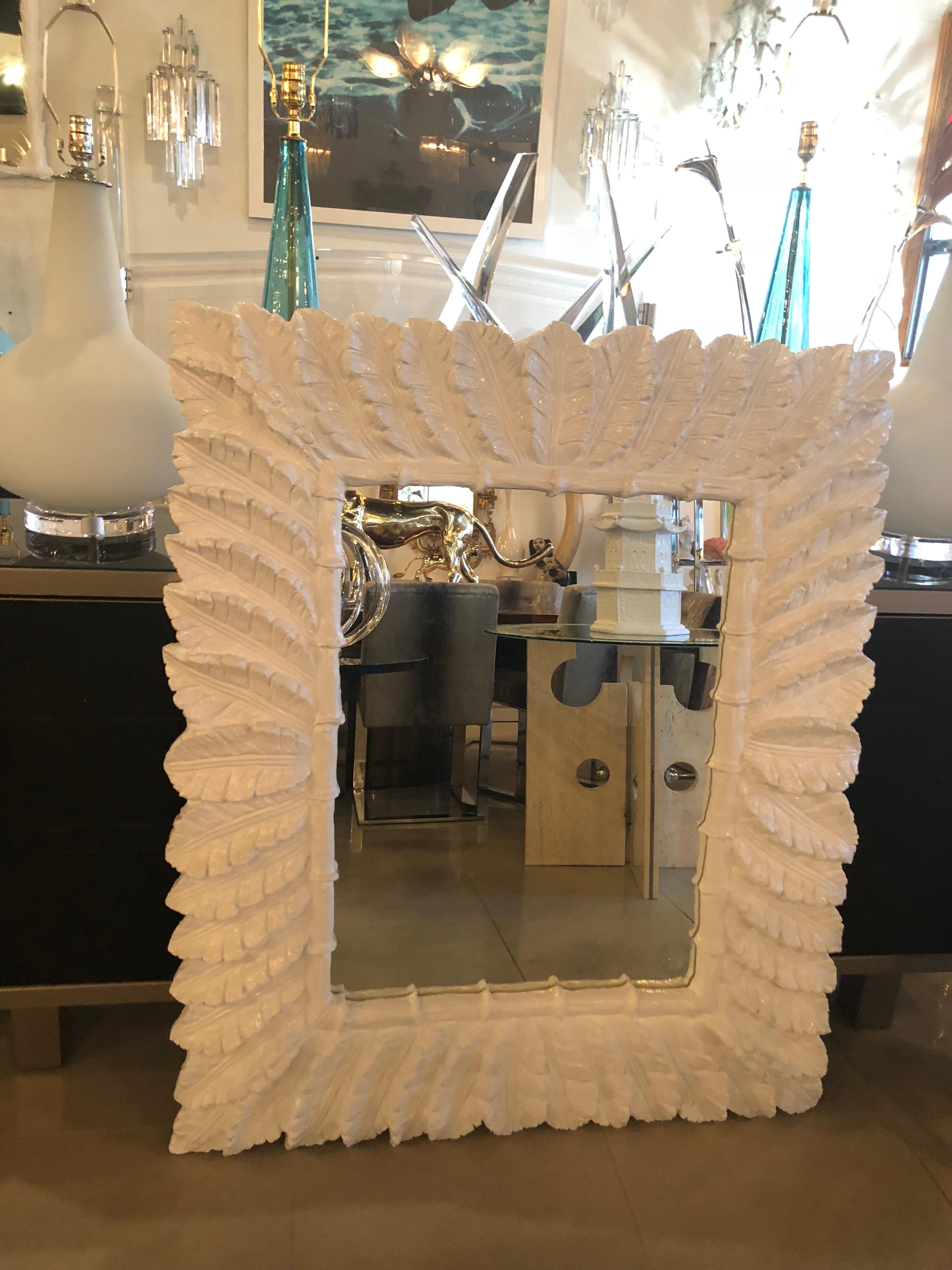 Lovely oversized vintage faux bamboo and tropical palm tree leaves leaf wall mirror. Newly lacquered in a white gloss.
Pair available. 