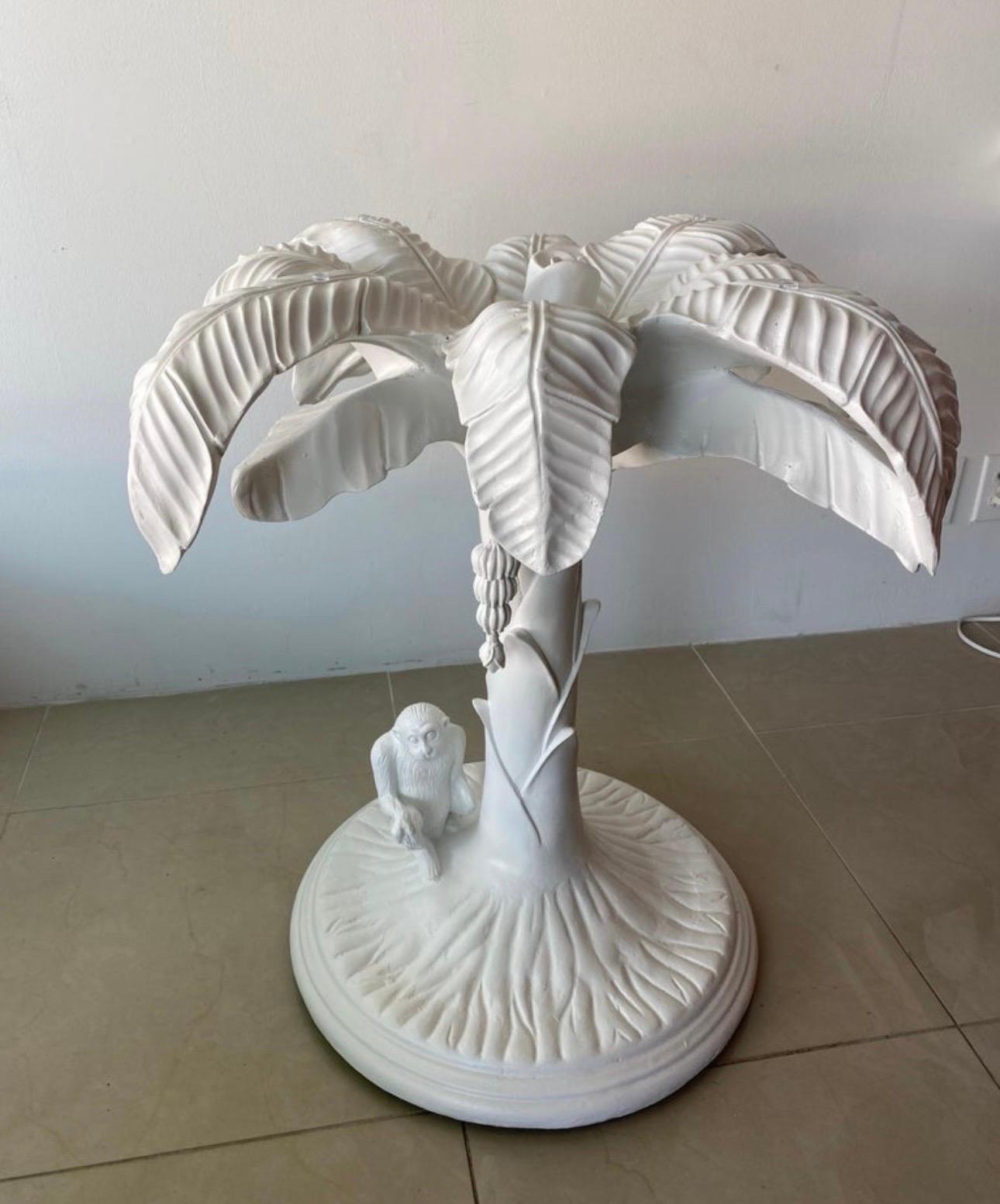 Lovely vintage palm tree with monkey and hanging bananas white table. This can be used as a dining table, center or entry table. I’ve placed a 36” piece of glass on top for scale. You can use smaller or much larger. The base is a heavy composite.