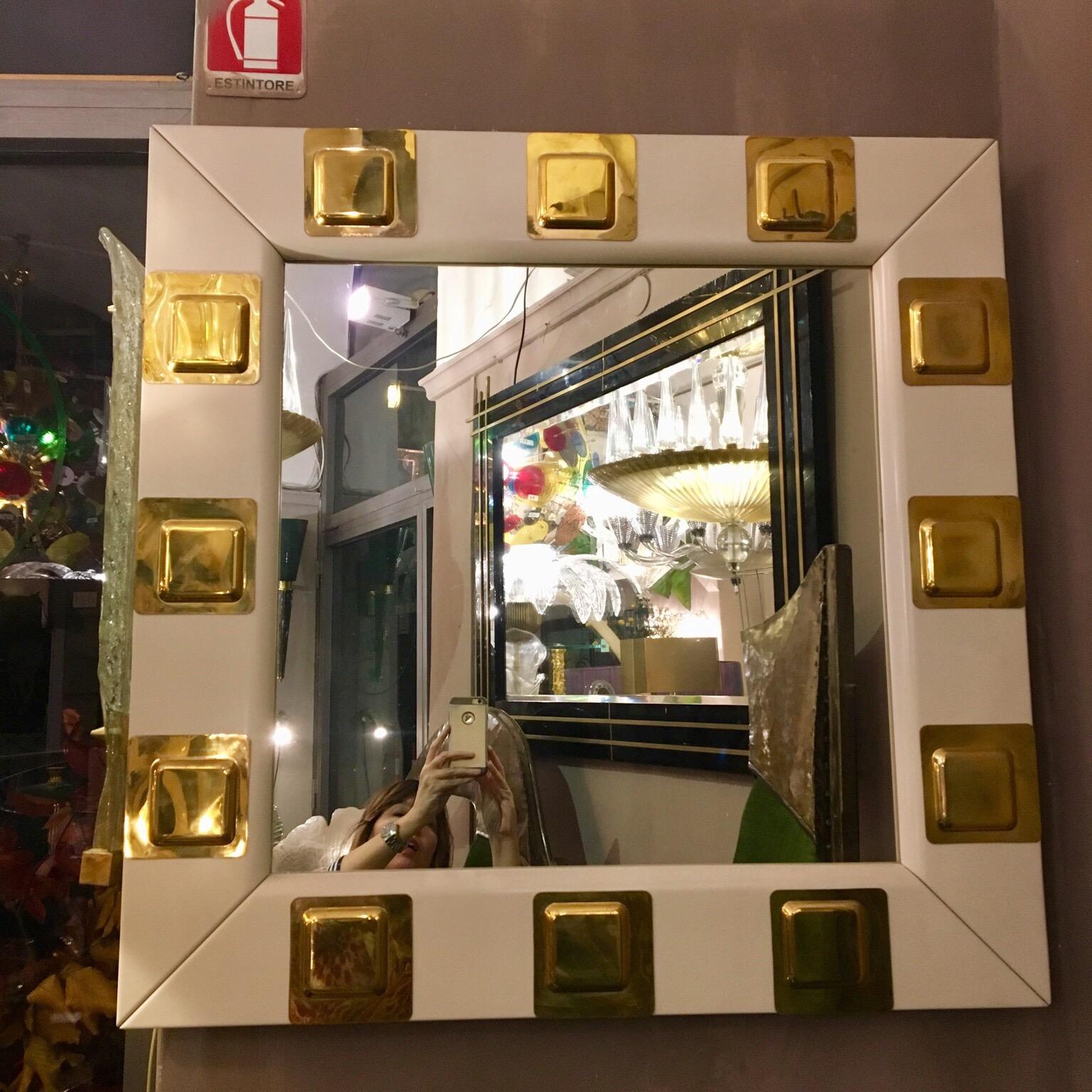 Vintage white lacquered wood and brass Italian square mirror. The pair is available.