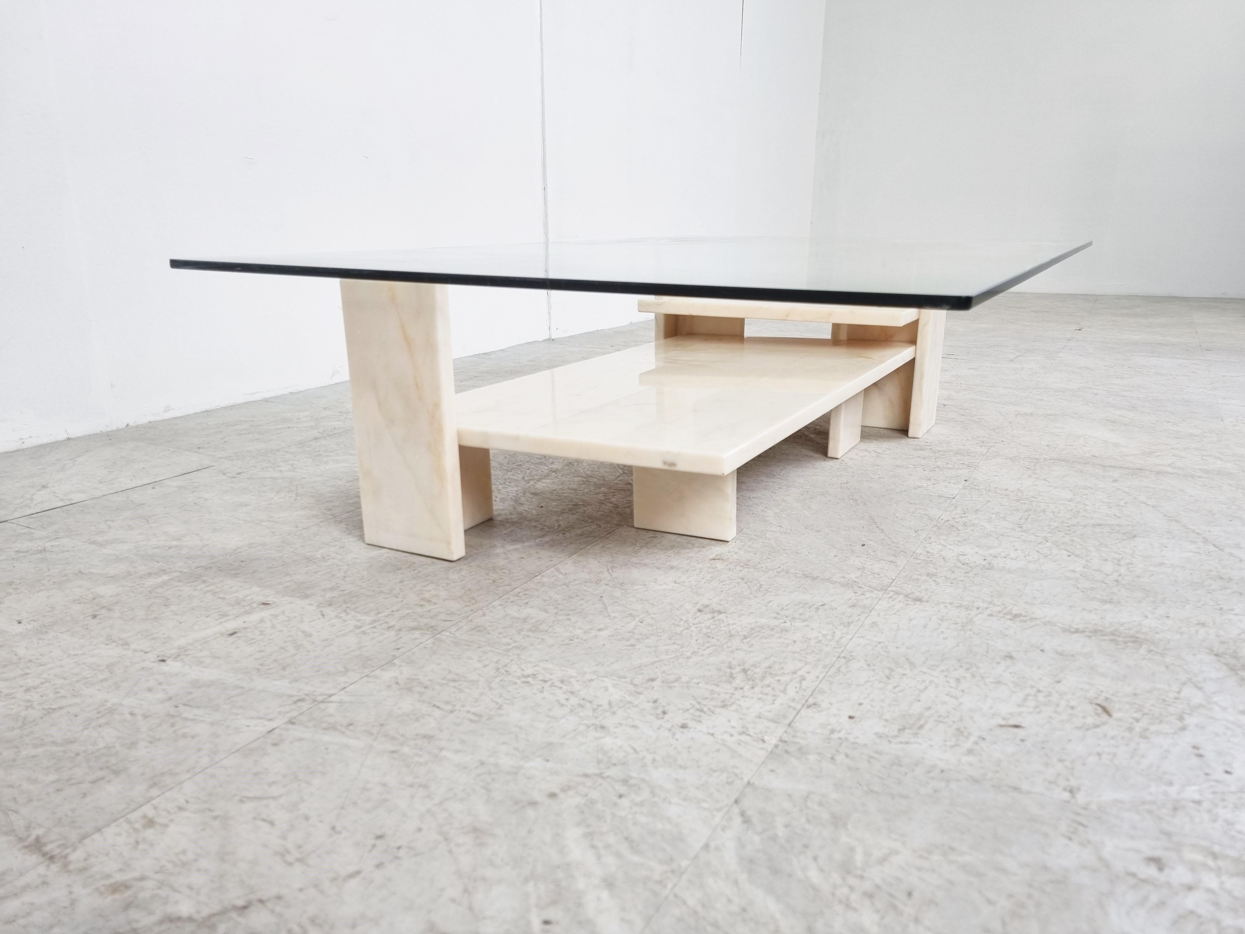 Architectural white marble coffee table with a clear glass top.

Very much in the style of the coffee tables by Willy Ballez.

The modern look/design mixes well with nowadays interiors.

We can also provide custom glass sizes. 

1970s -