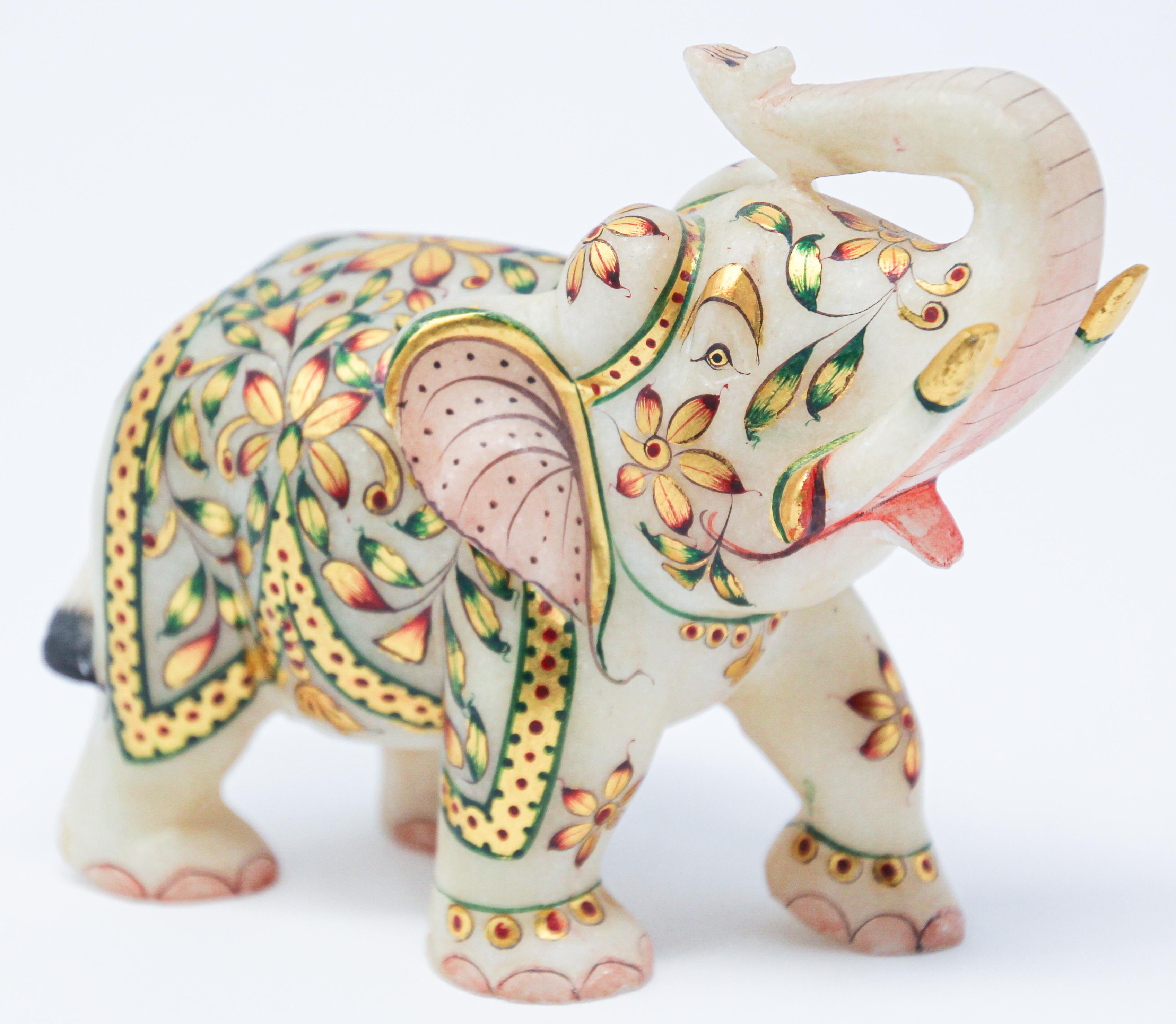 Vintage jeweled elephant sculpture paper weight wearing traditional ceremonial costume.
Finely hand painted with colorful gold, green and red color paint.
Collectible hand carved white marble stone sculpture figurine elephant with emboss painting